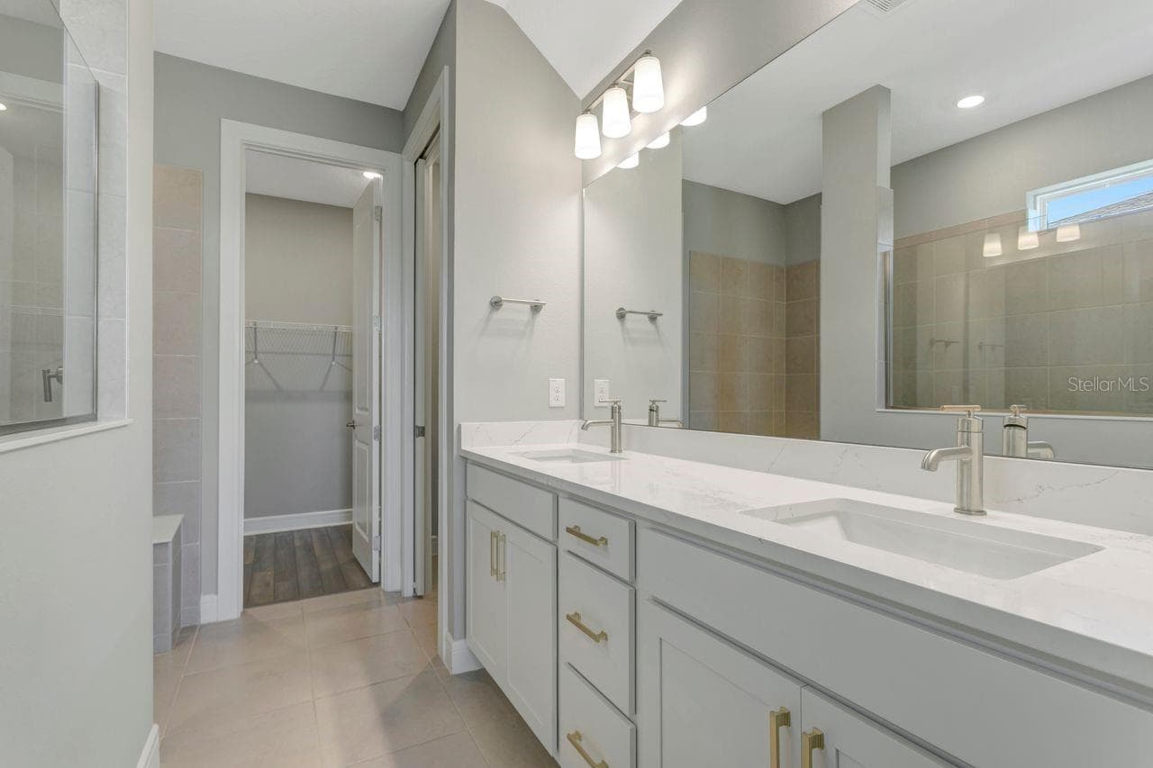 Primary Ensuite Bath with dual sinks and private water closet - 9909 LONGMEADOW AVE, PARRISH