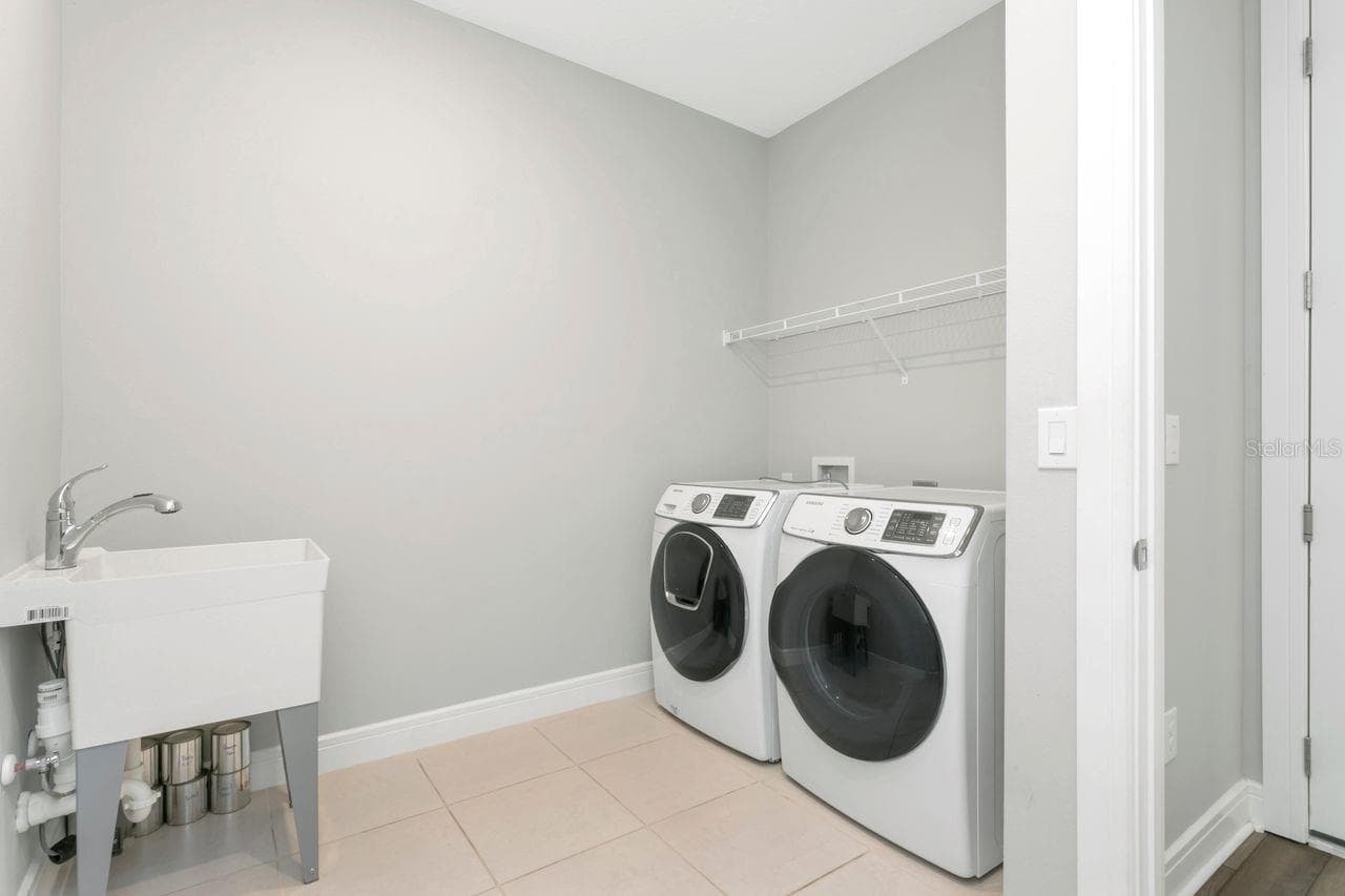 Laundry Room with utility sink - 1st floor - 9909 LONGMEADOW AVE, PARRISH