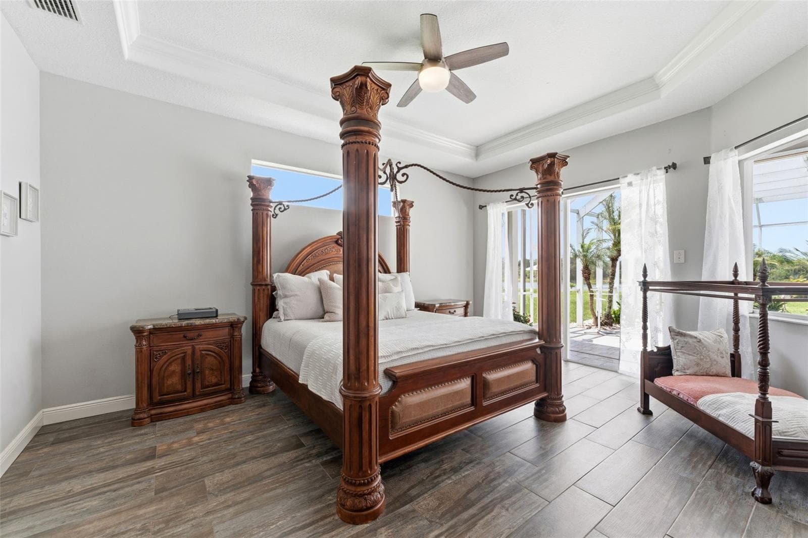 King Suite Primary Bedroom Featuring Dual Closets, Tray Ceiling and Panoramic Outdoor Views - 24355 HIDEOUT TRL, LAND O LAKES