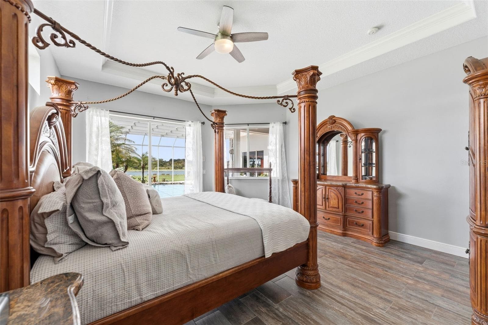 Wake up to Stunning Lake and Pool Views From the Comfort of your Private Master Bedroom Retreat - 24355 HIDEOUT TRL, LAND O LAKES
