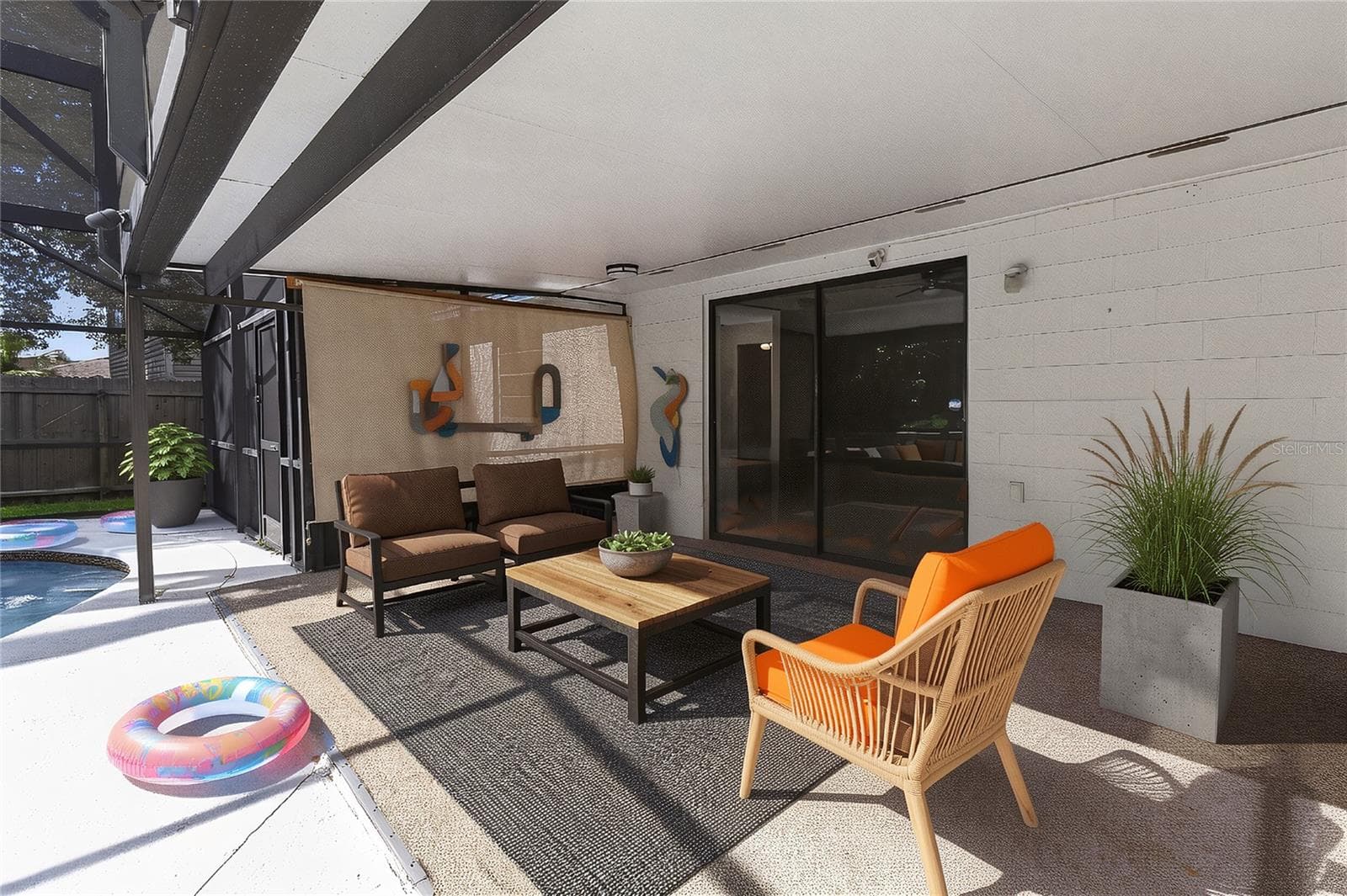Shaded living space in the outdoor back patio. Enjoy additional living spacing connecting the indoor and outdoors. (virtual furnishings) - 656 LITTLE WEKIVA RD, ALTAMONTE SPRINGS