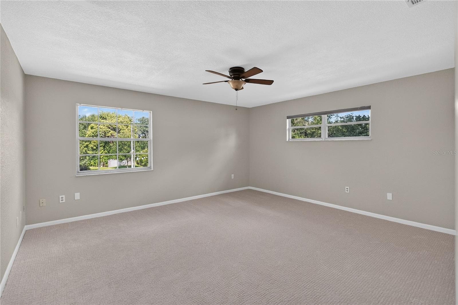 View 2 - Primary Bedroom (15x16) with en Suite bathroom, dual closets, light & bright with two windows - 656 LITTLE WEKIVA RD, ALTAMONTE SPRINGS