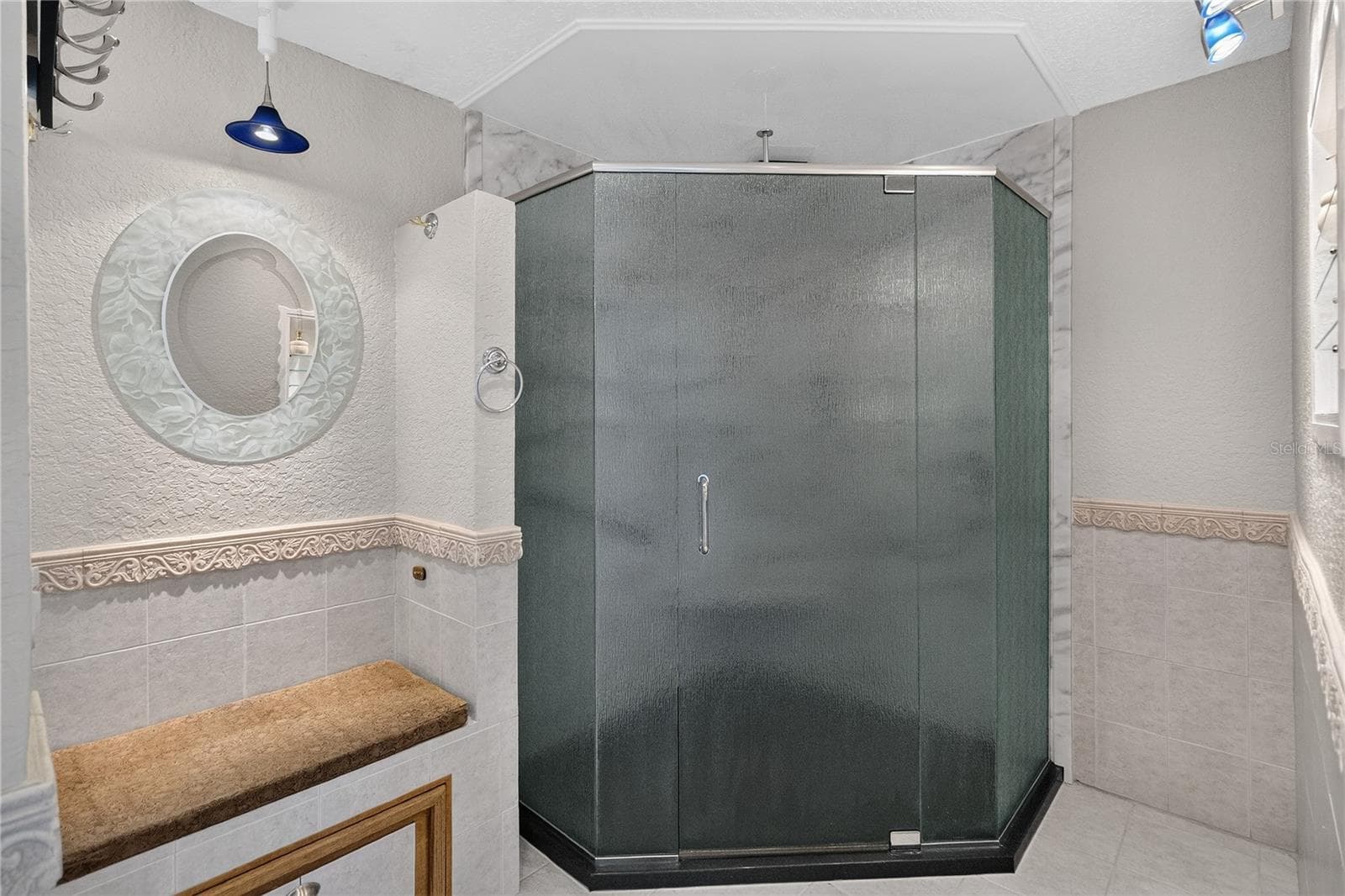 Walk-in shower for ease of access (ceiling-mounted rain shower head). A built in ledge outside the shower offers a convenient spot for towels, toiletries, or items for easy reach. - 656 LITTLE WEKIVA RD, ALTAMONTE SPRINGS