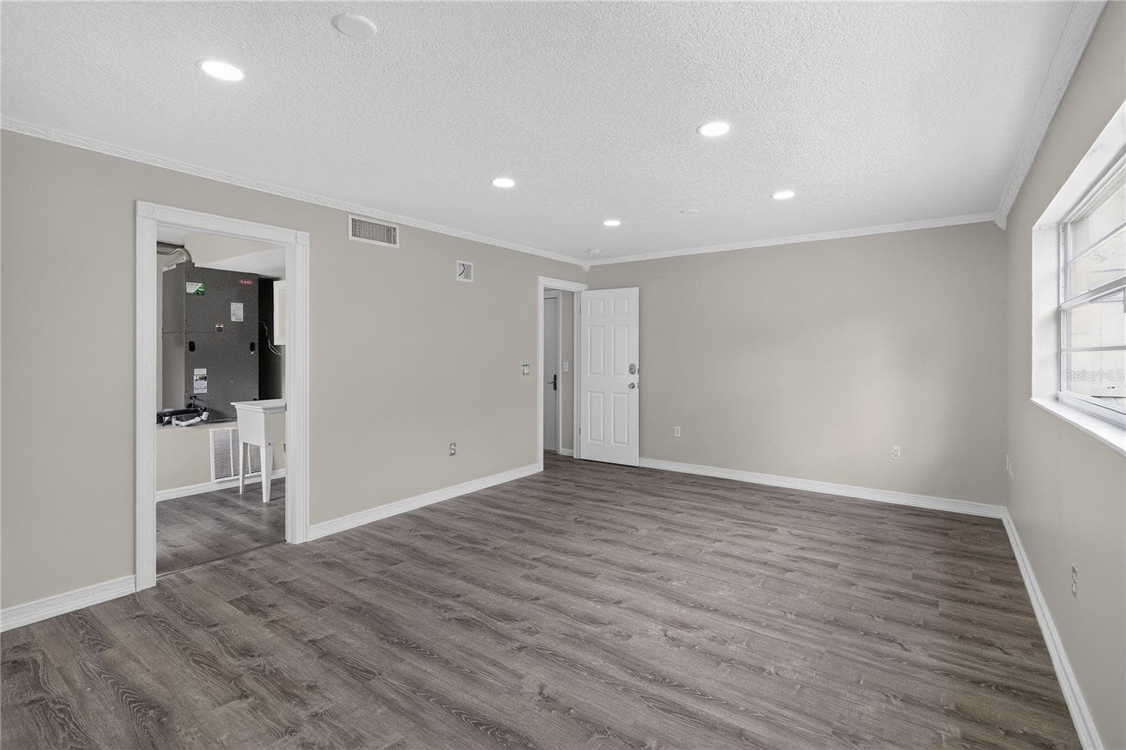 View 2 - Bedroom #5, en Oversized ground floor bedroom offers flexible use — ideal as a guest suite, craft studio, home office, fitness room. This multi purpose space has GREAT VALUE and not just “another bedroom.” - 656 LITTLE WEKIVA RD, ALTAMONTE SPRINGS