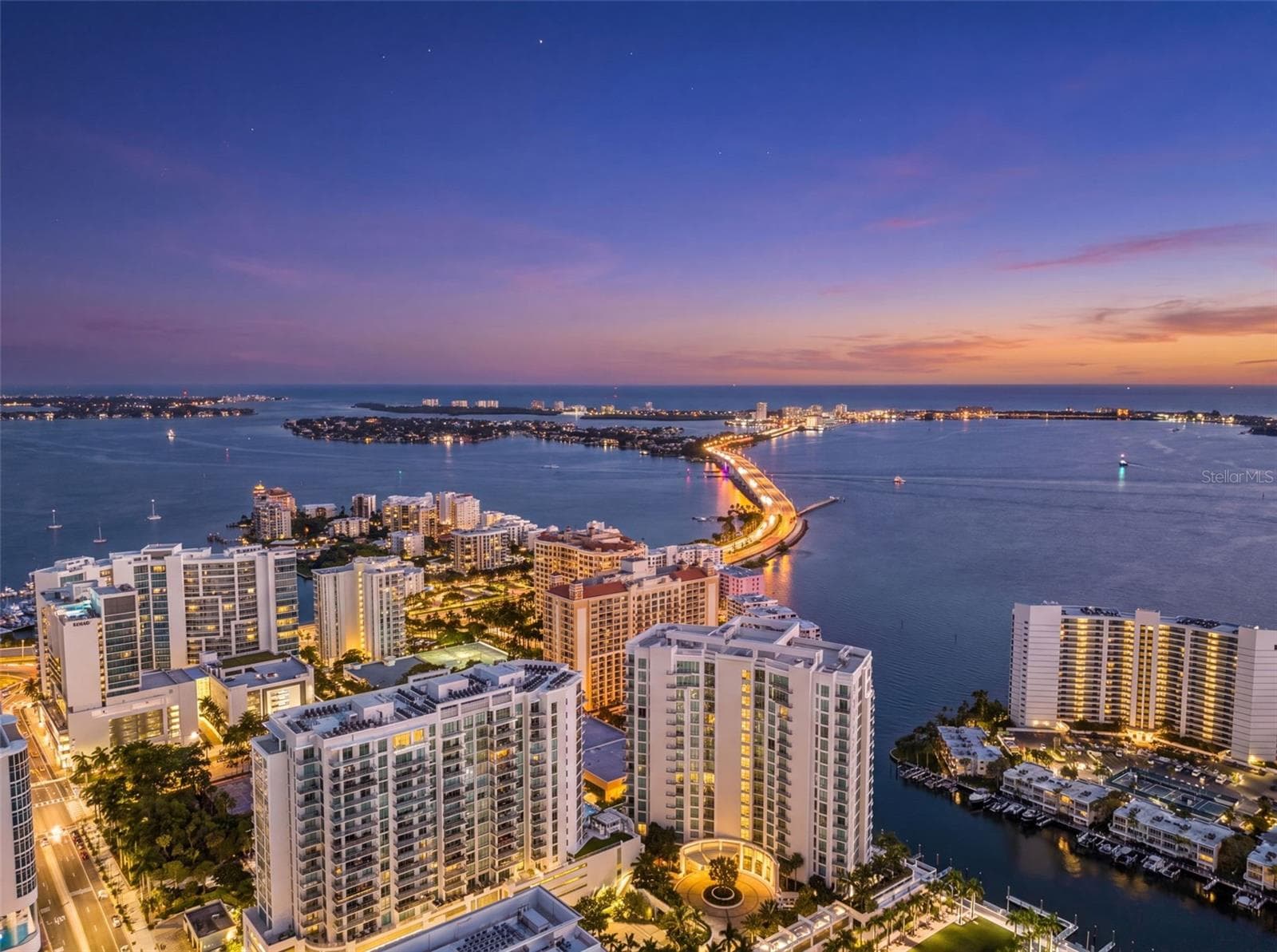 Aerial view of BAYSO in the evening - 301 QUAY COMMONS #1009, SARASOTA