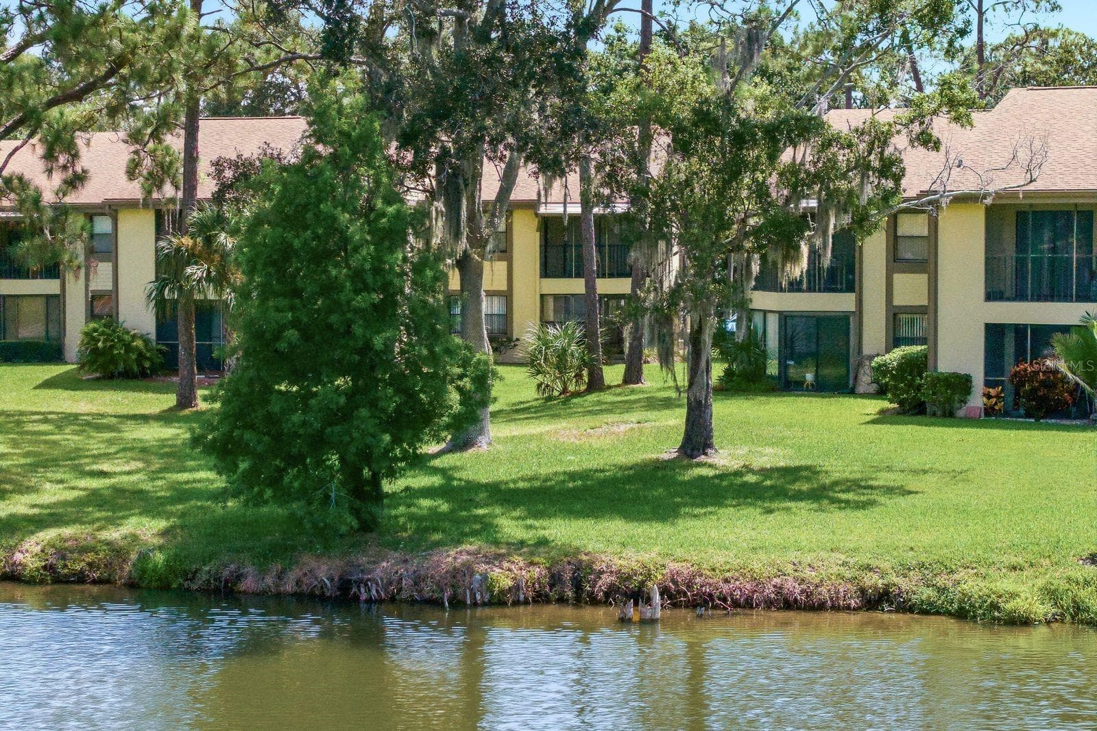 Building view from Pond - 10 WOODLAKE PL, OLDSMAR