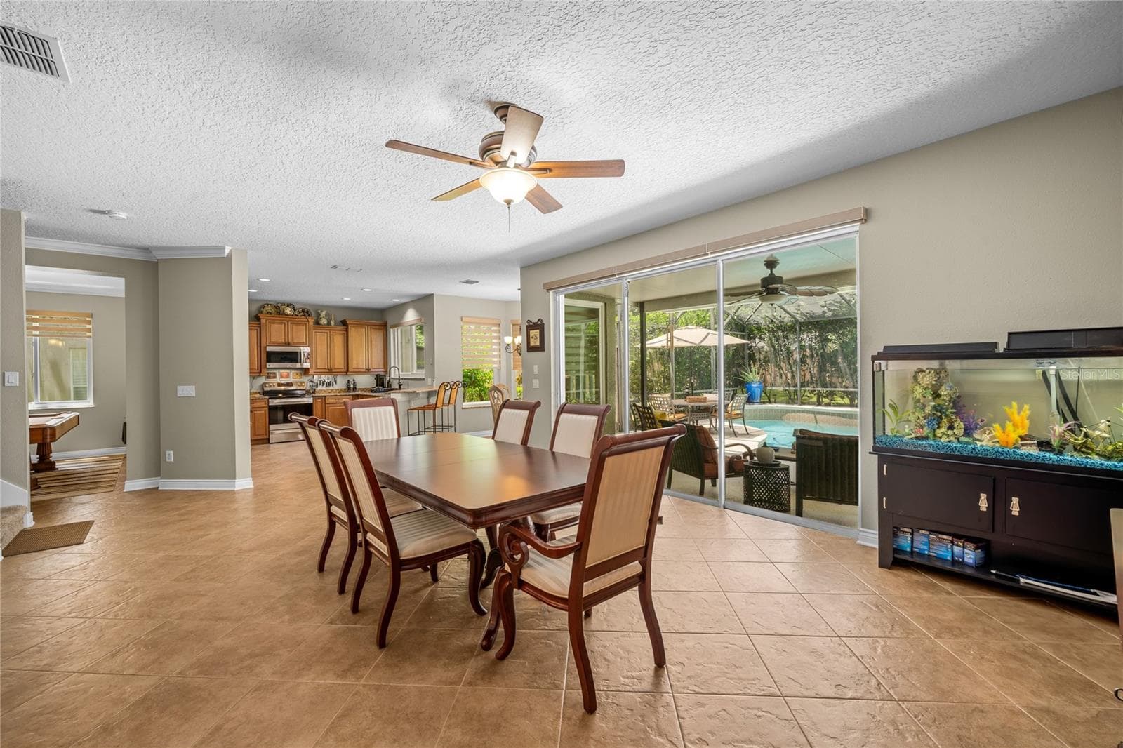 Casual family room located off the kitchen, now being utilized as a dining area. - 483 VIA TUSCANY LOOP, LAKE MARY