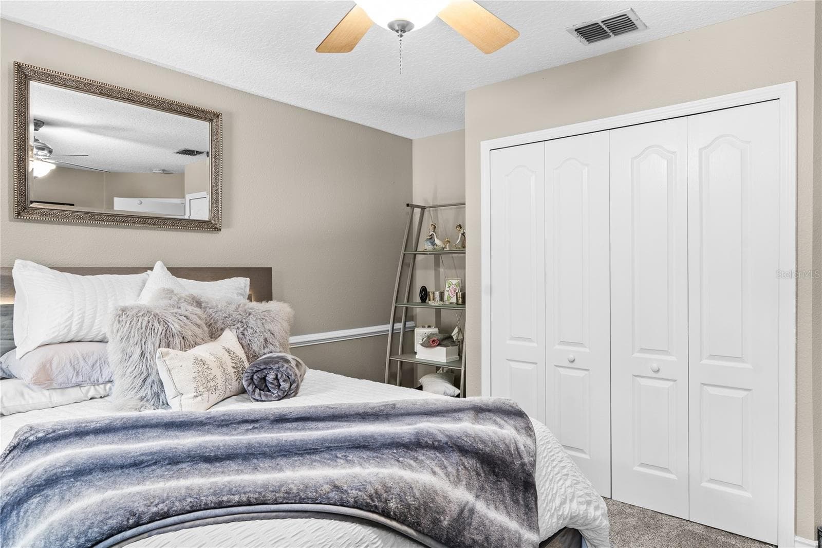 The secondary bedrooms are spacious with fresh neutral painting - 483 VIA TUSCANY LOOP, LAKE MARY