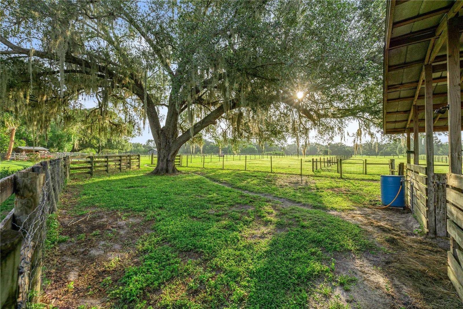 Side pasture to the stalls - 15027 SW 91ST ST, ARCHER