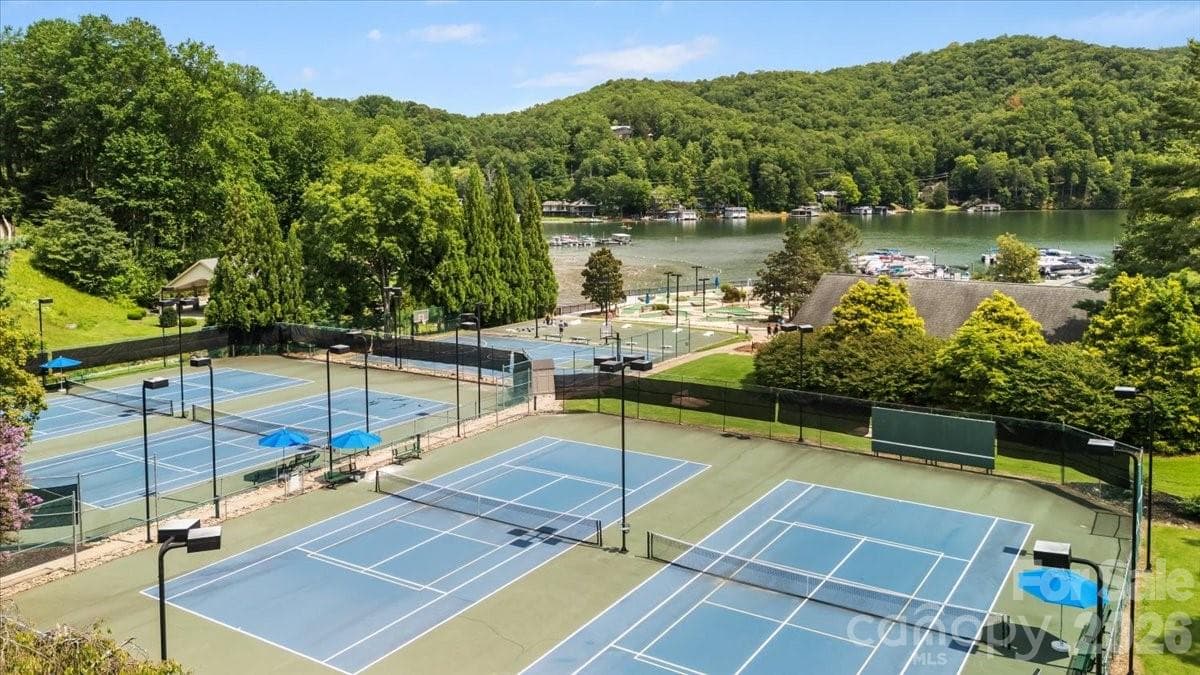 This property features extensive amenities at Rumbling Bald, offering a premier lifestyle experience. - 179 Rock Spring Road, Lake Lure