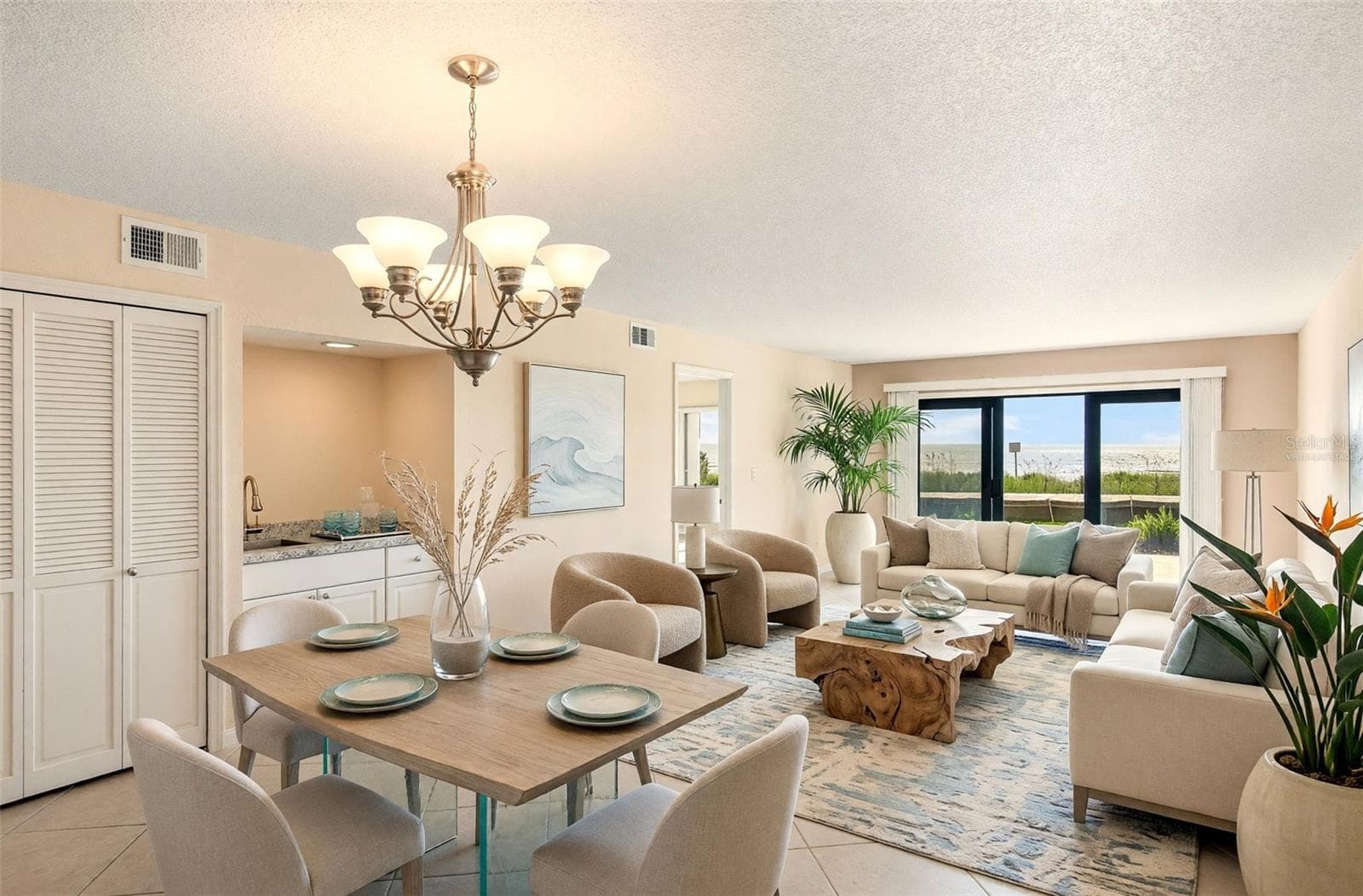 Living dining area virtually staged - 2600 OCEAN SHORE BLVD #111, ORMOND BEACH