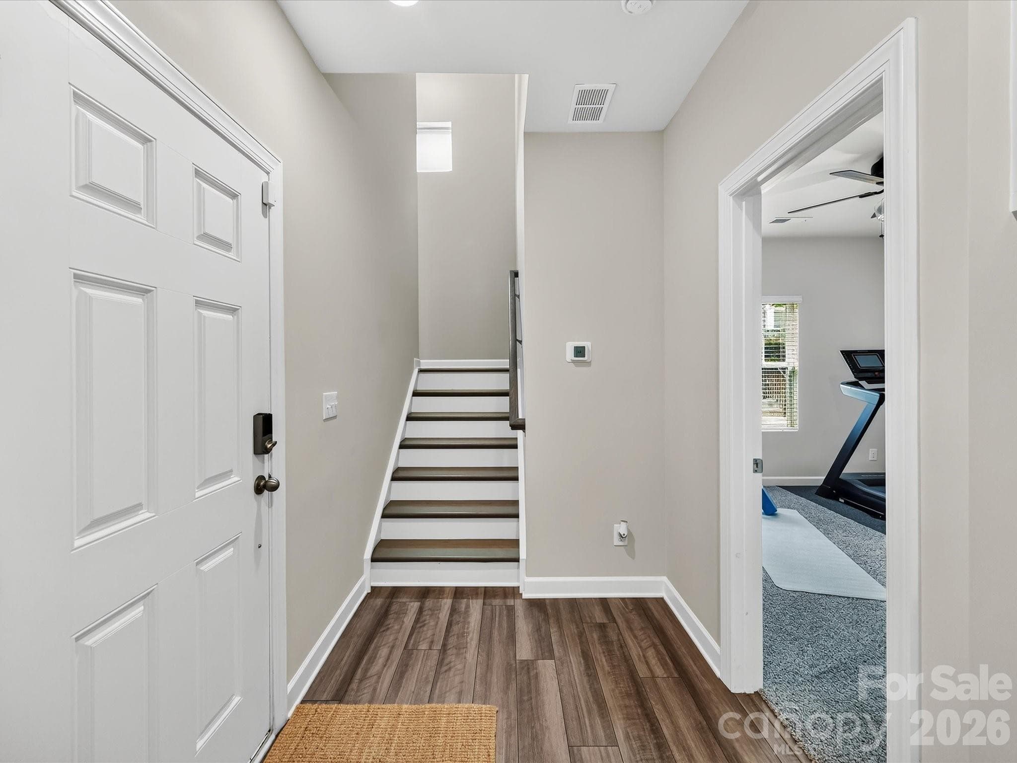 Spacious foyer welcomes you with durable luxury flooring, high ceilings, and a bright, open feel. - 4552 Millennium Avenue, Charlotte