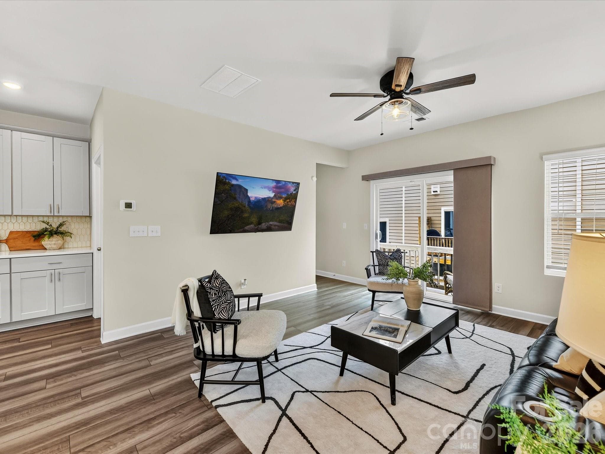 Expansive family room provides an inviting space to relax, entertain, and enjoy open-concept living. - 4552 Millennium Avenue, Charlotte