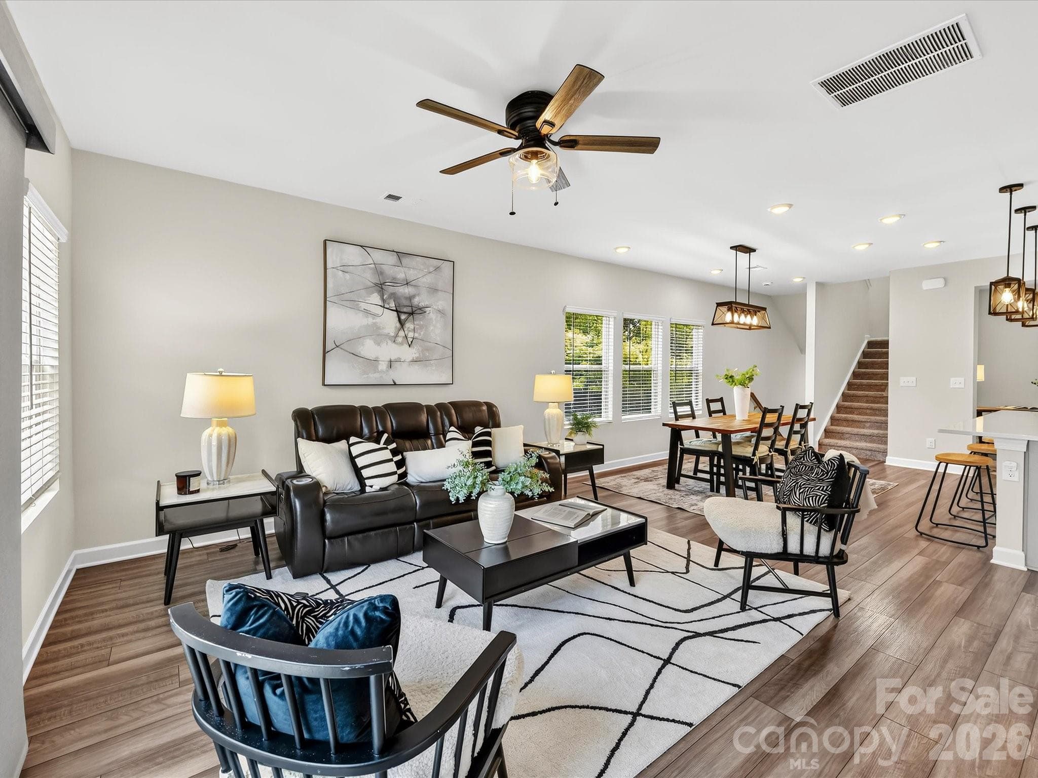 Expansive family room provides an inviting space to relax, entertain, and enjoy open-concept living. - 4552 Millennium Avenue, Charlotte