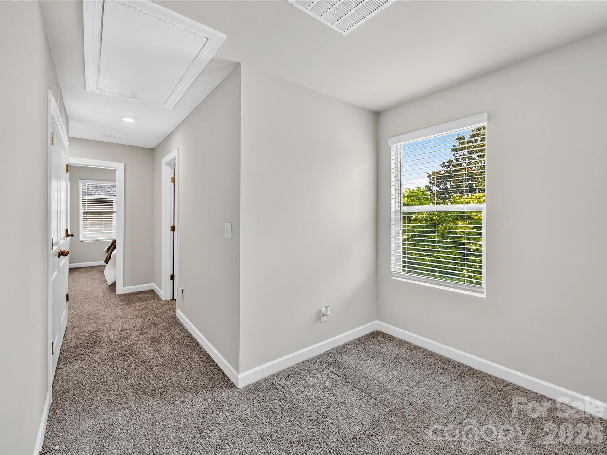 Generous loft provides flexible living space for a media room, play area, or additional lounge. - 4552 Millennium Avenue, Charlotte