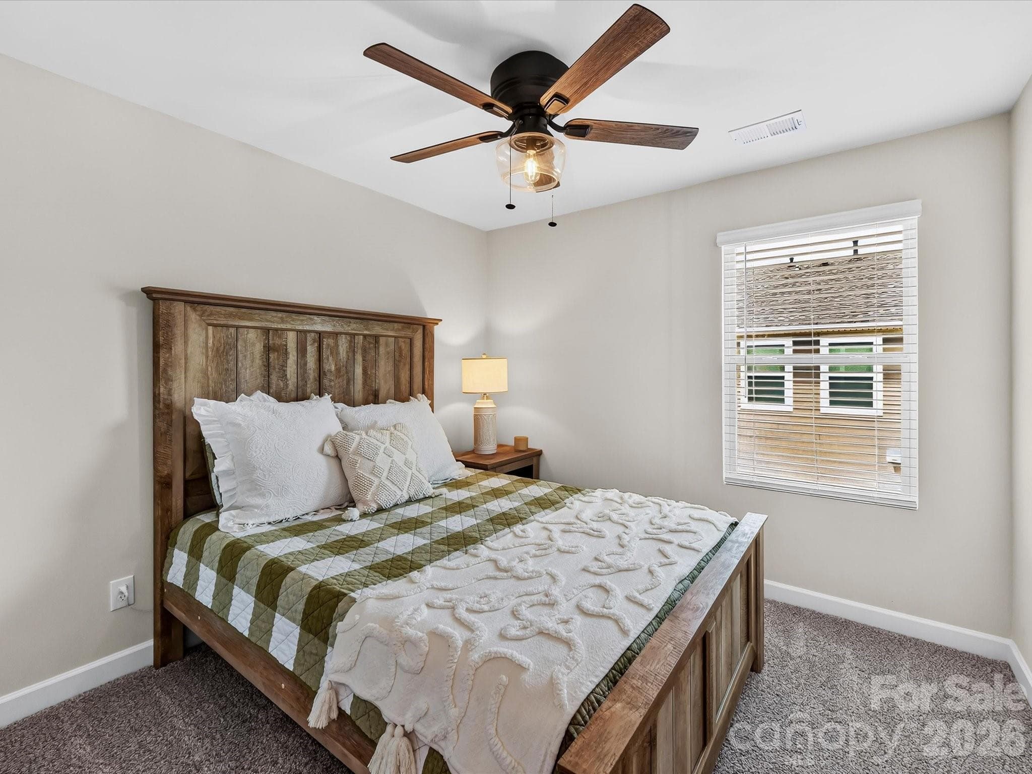 Spacious secondary bedroom offers comfort, natural light, and flexible use for family, guests, or a home office. - 4552 Millennium Avenue, Charlotte