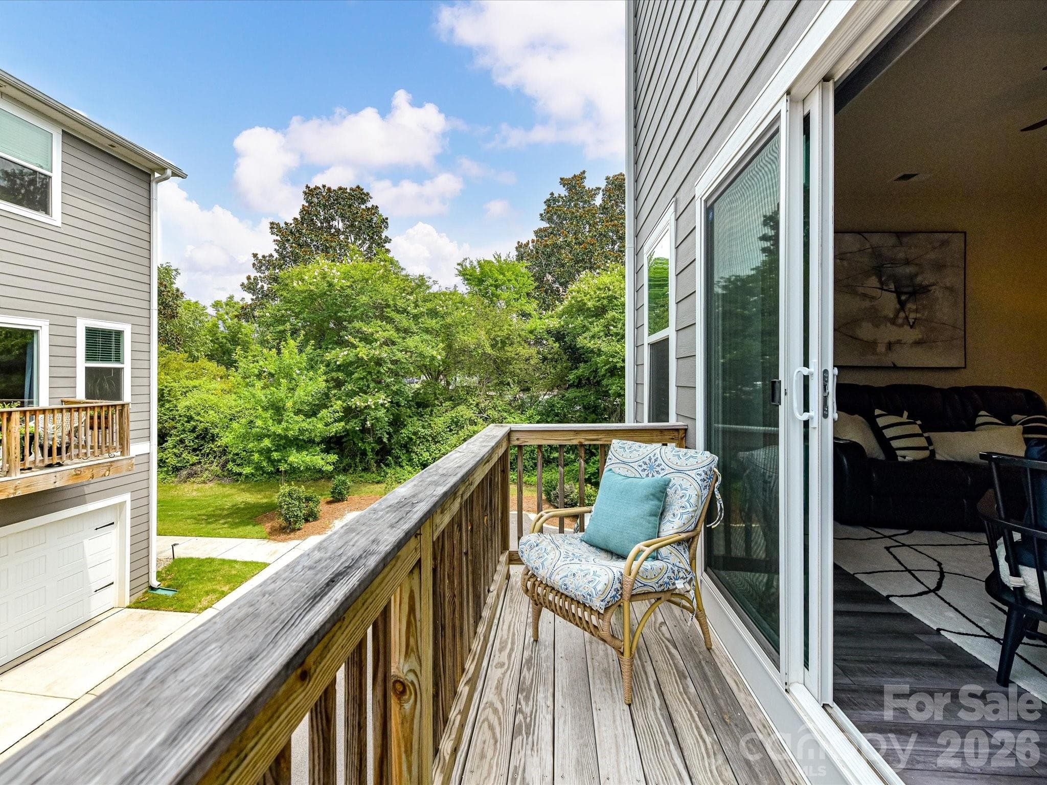 Private covered balcony provides the perfect spot to enjoy your morning coffee or unwind while overlooking the neighborhood. - 4552 Millennium Avenue, Charlotte