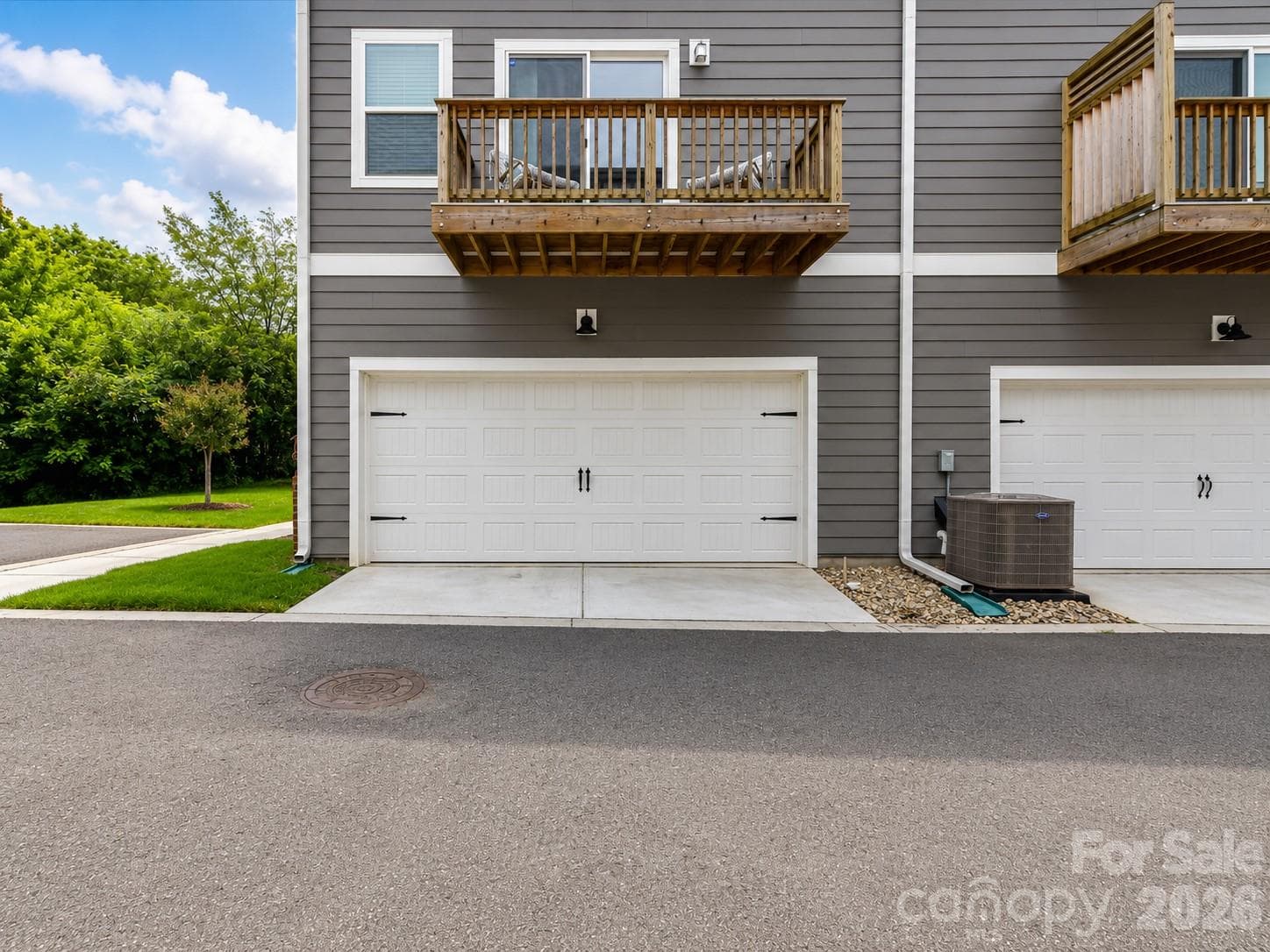 Oversized two-car garage offers ample space for vehicles, storage, and all of your outdoor gear. - 4552 Millennium Avenue, Charlotte