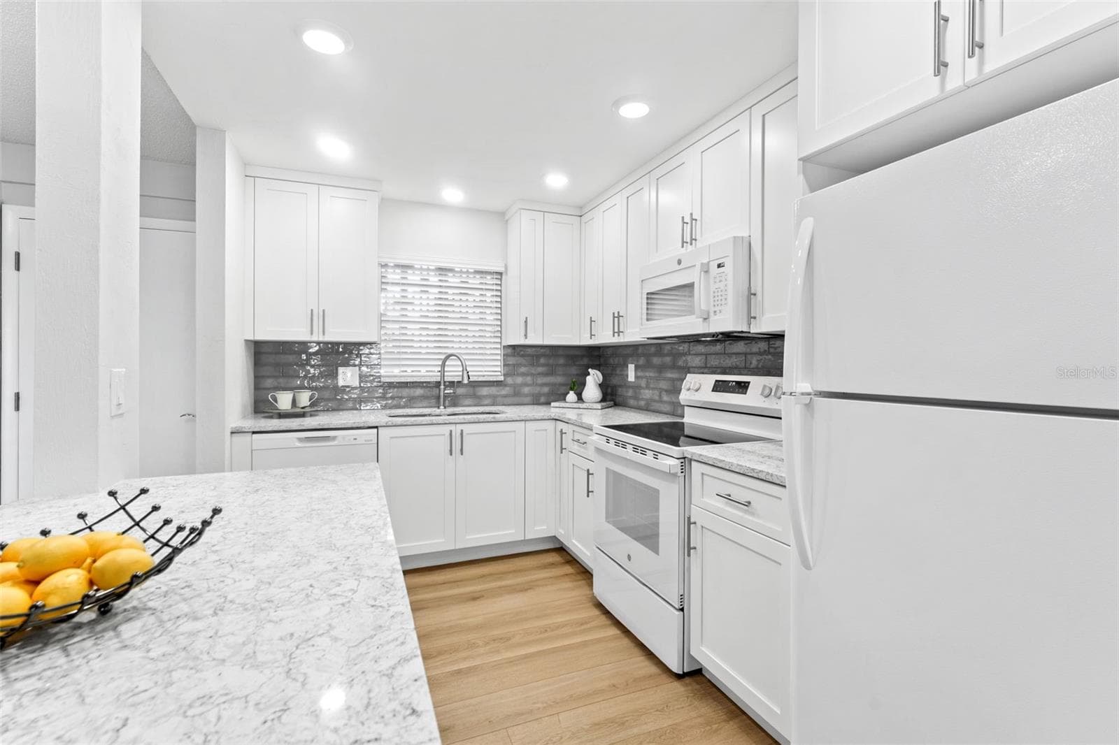 Cambria quartz countertops throughout. - 3606 S PENINSULA DR #102, PORT ORANGE