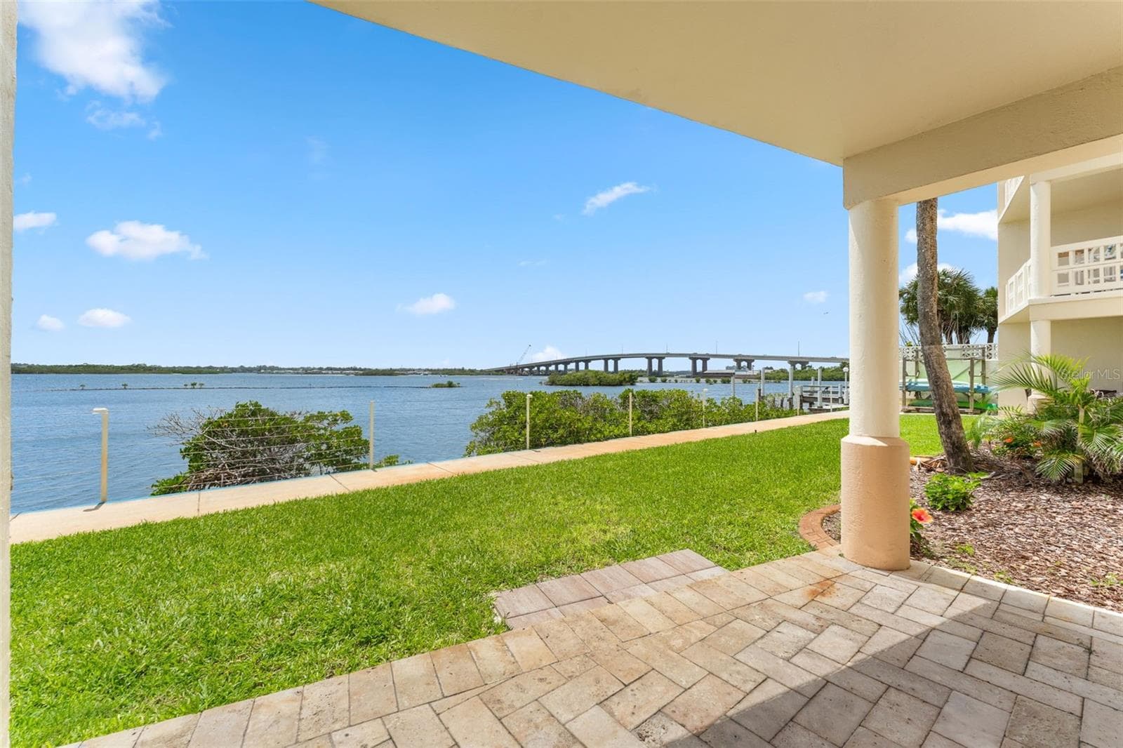 Beautifully pavered lanai with a view right on the water. - 3606 S PENINSULA DR #102, PORT ORANGE