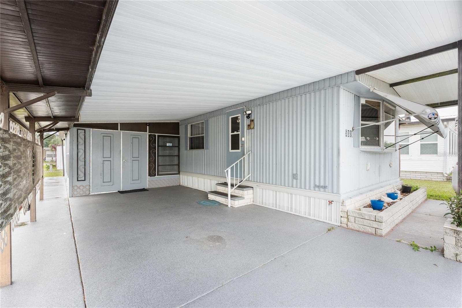 Nice carport on this home. - 5318 ASTRID DR, ZEPHYRHILLS