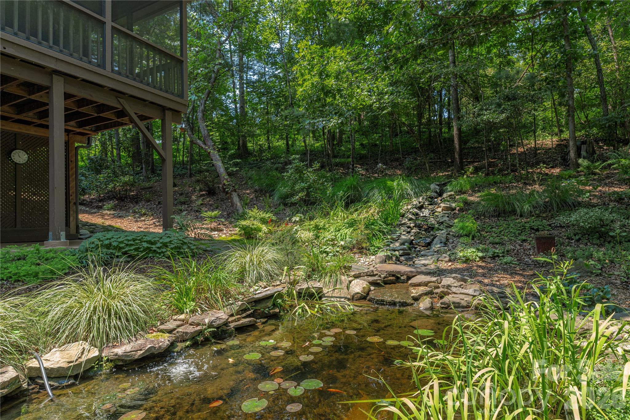 Beautiful pond and stone work in the backyard - 35 Hillcreek Drive, Asheville