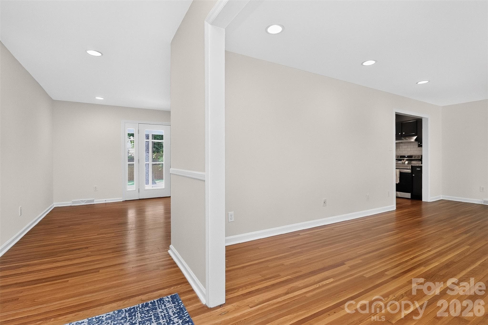 View into family room and living/ dining room - 4726 Walden Court, Charlotte
