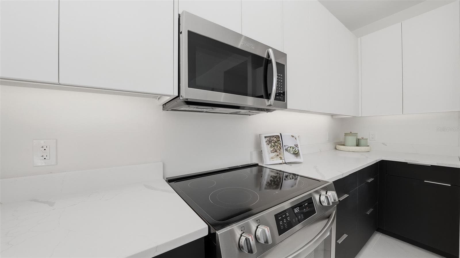 This designer kitchen is ready for your special chef's cuisine with its European cabinetry, stainless appliances and luxurious quartz countertops. - 430 KUMQUAT CT #202, SARASOTA