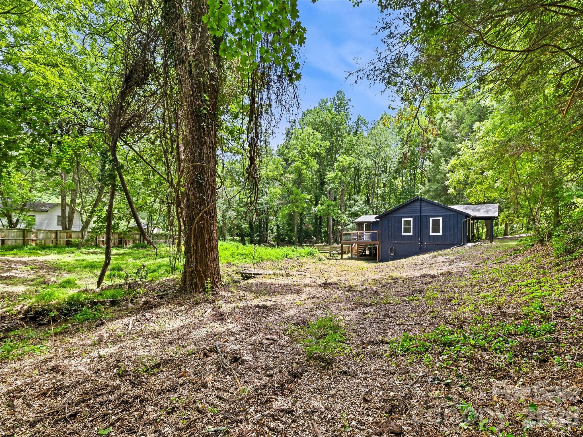 View of home from edge of side lawn. - 468 Governors View Road, Asheville