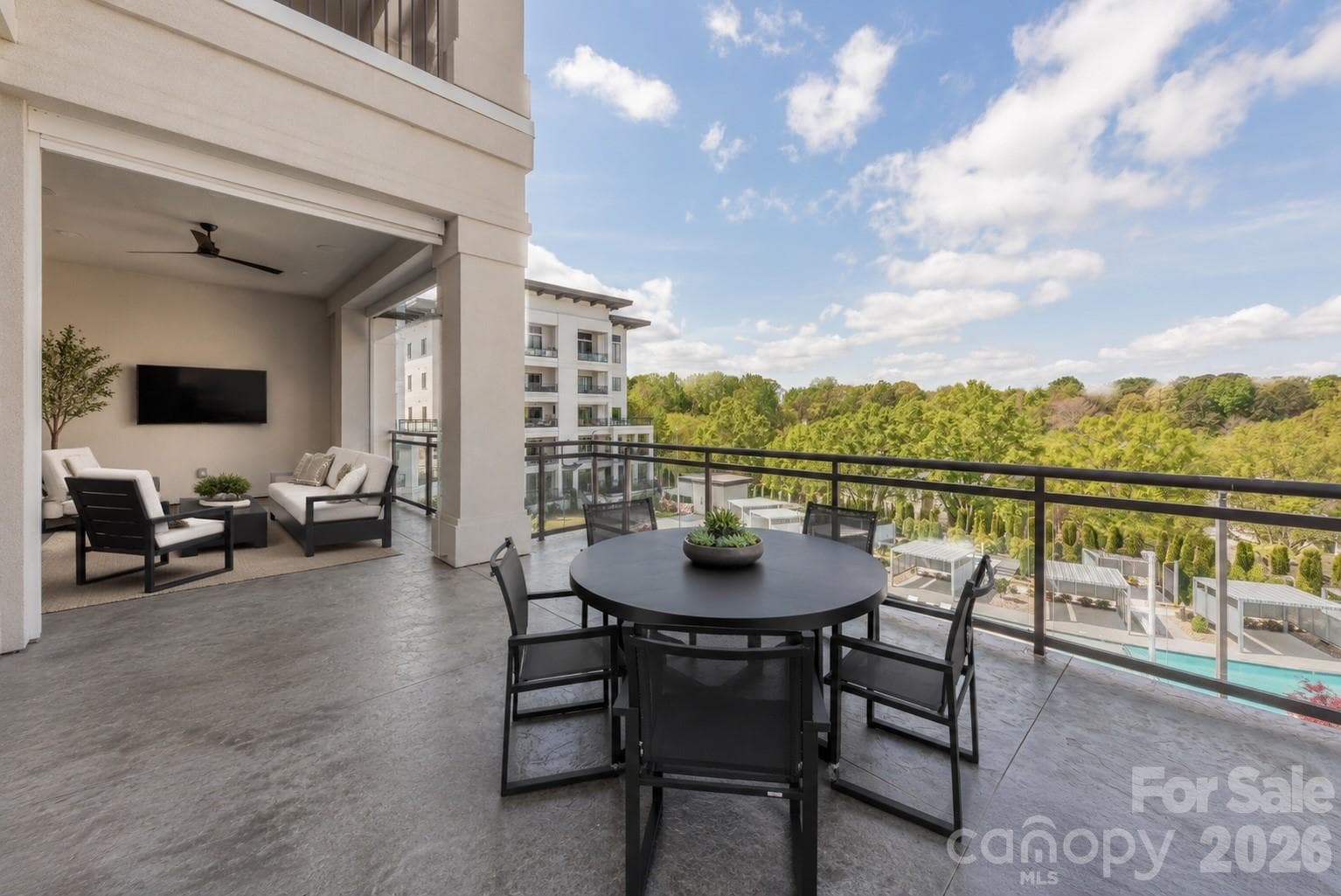 The outdoor living space of 1555 sq ft including the balcony off master - 19329 Watermark Drive, Cornelius