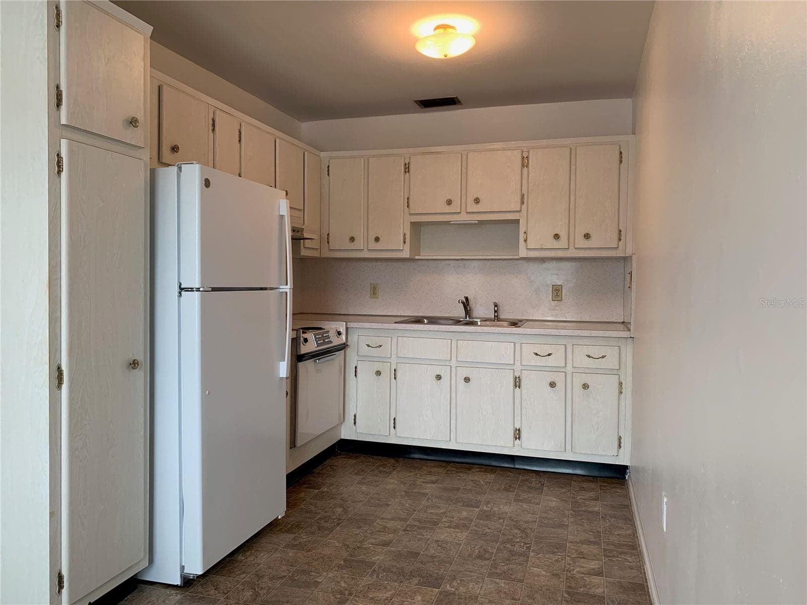 Kitchen...TONS of cabinets and storage - 8126 112TH ST #203, SEMINOLE