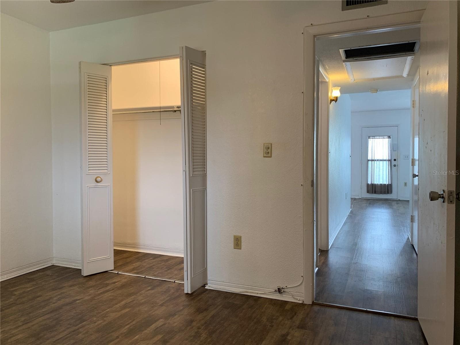 In bedroom 2, wall closet and view down hallway goes back to living room - 8126 112TH ST #203, SEMINOLE