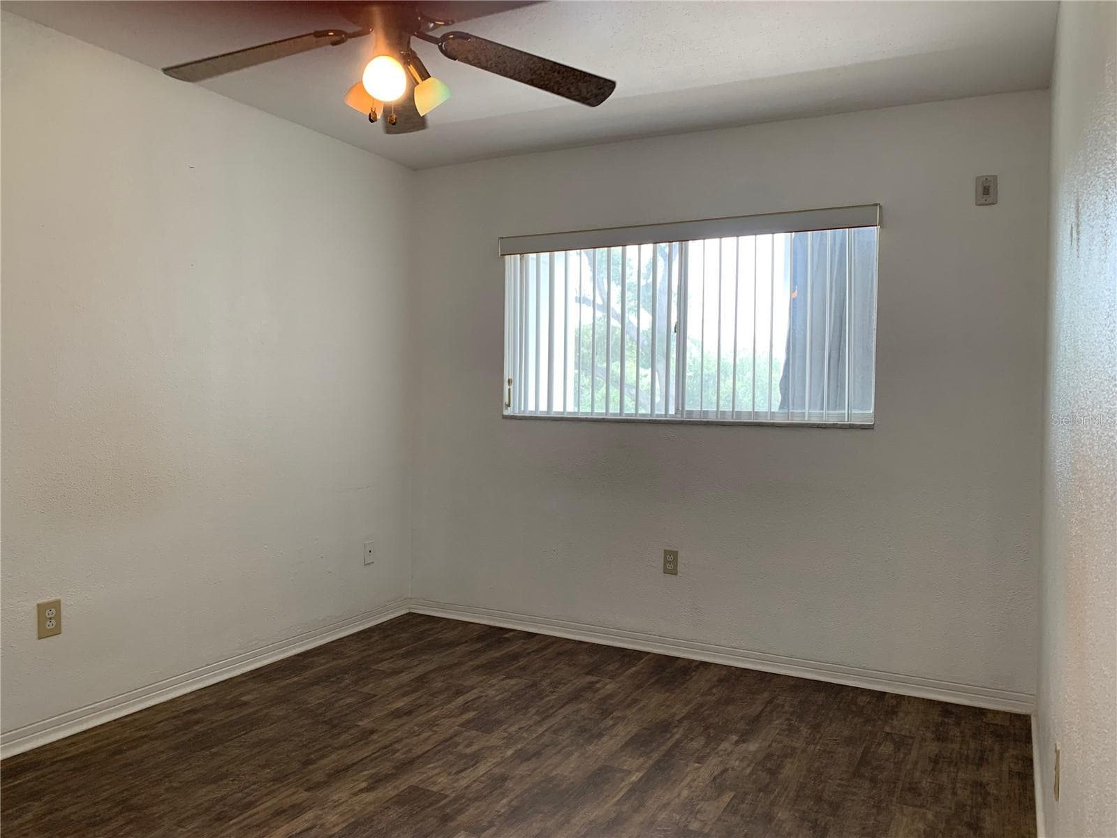 Primary bedroom (has walk-in), window looks out on back patio with garden view - 8126 112TH ST #203, SEMINOLE