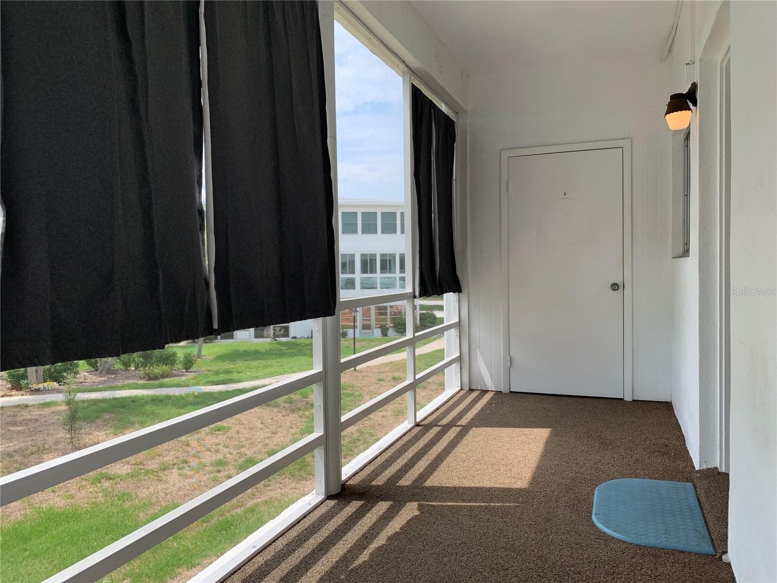 Back screened porch, door is storage closet with AC and water heater and additional storage space - 8126 112TH ST #203, SEMINOLE