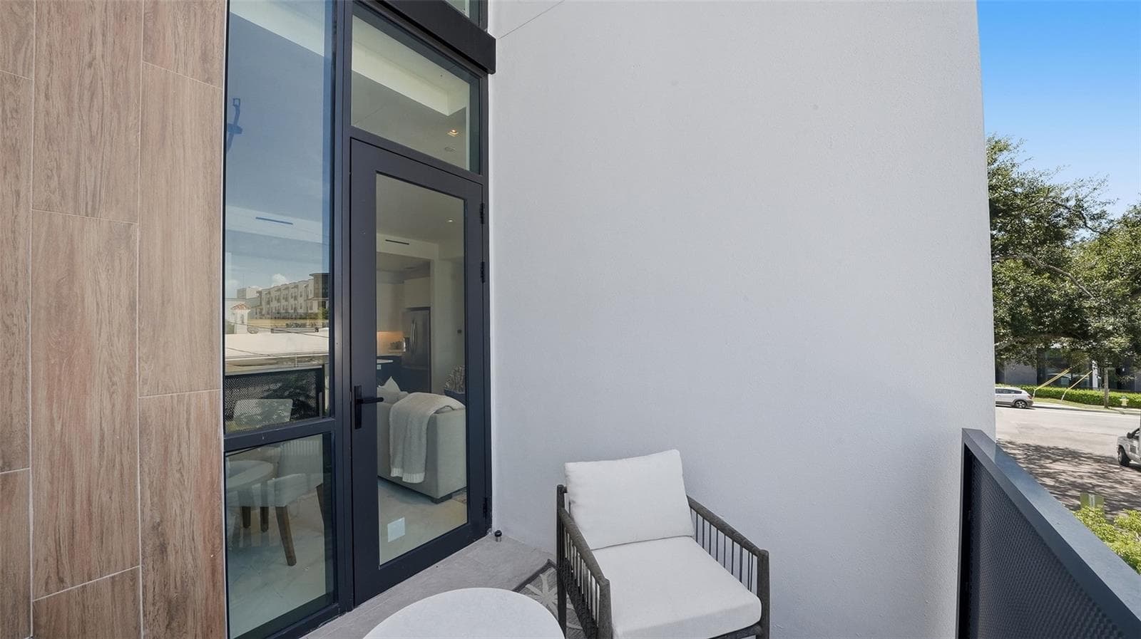 The living/dining room features its own west facing private patio, in addition to a 2nd patio off the primary suite. Both are ready for observation of Sarasota's dramatic, colorful sunset skies. - 430 KUMQUAT CT #202, SARASOTA