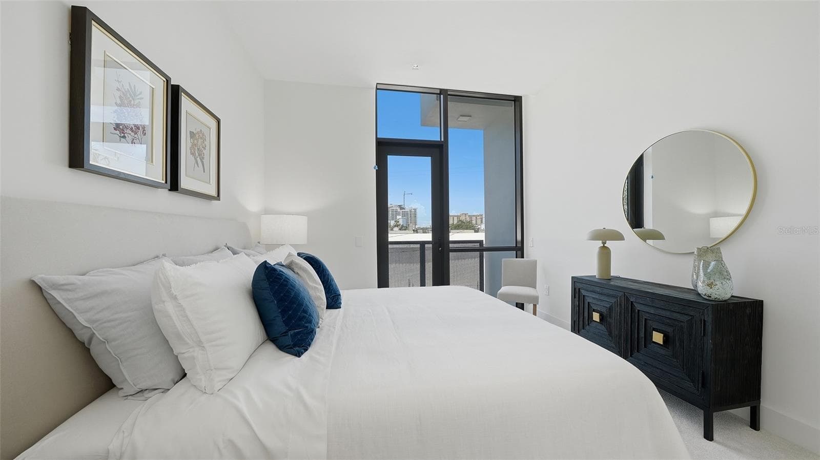 This primary suite is spacious and also light, bright which features a walk in closet and full bath with dual sinks as well as its own private west facing patio. - 430 KUMQUAT CT #202, SARASOTA