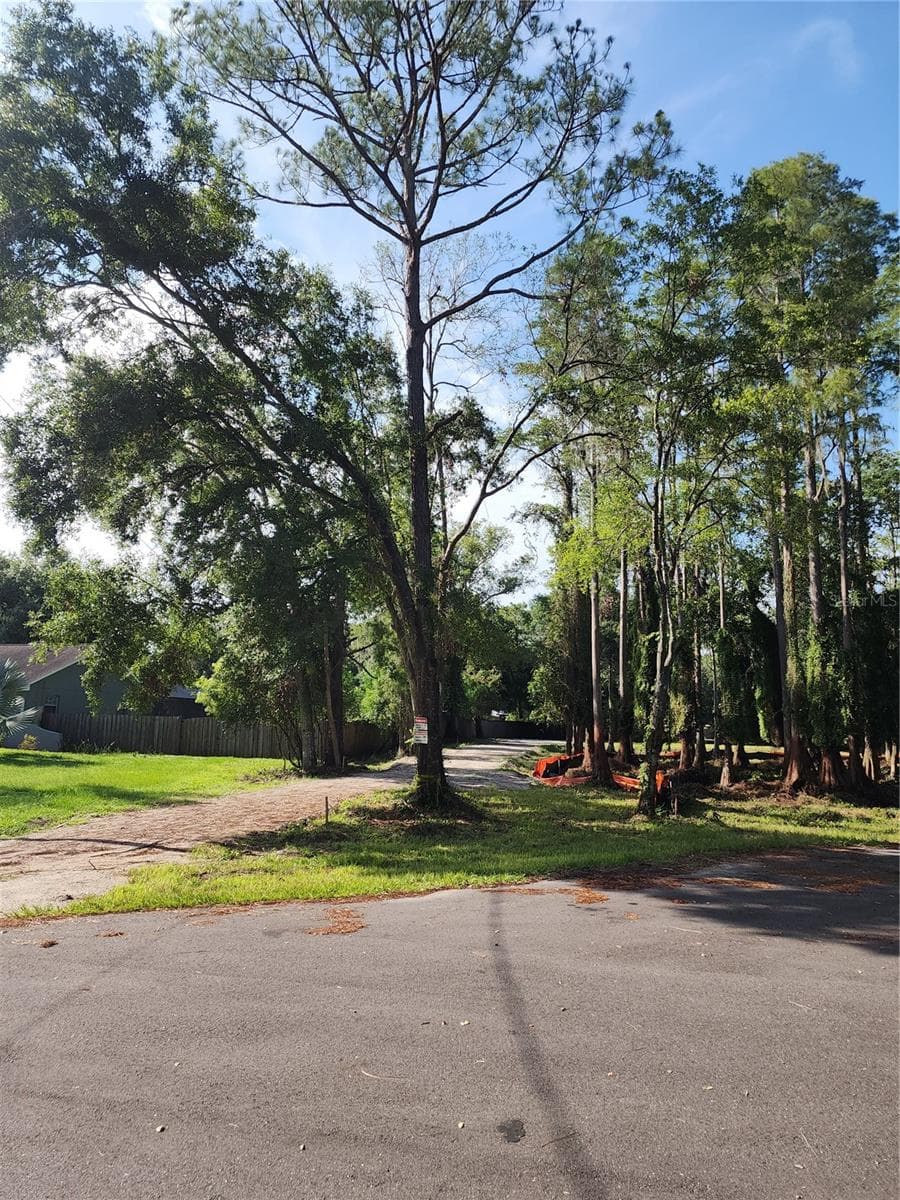 From the street looking up driveway to the lot. - 7709 WINDWARD WAY, ODESSA
