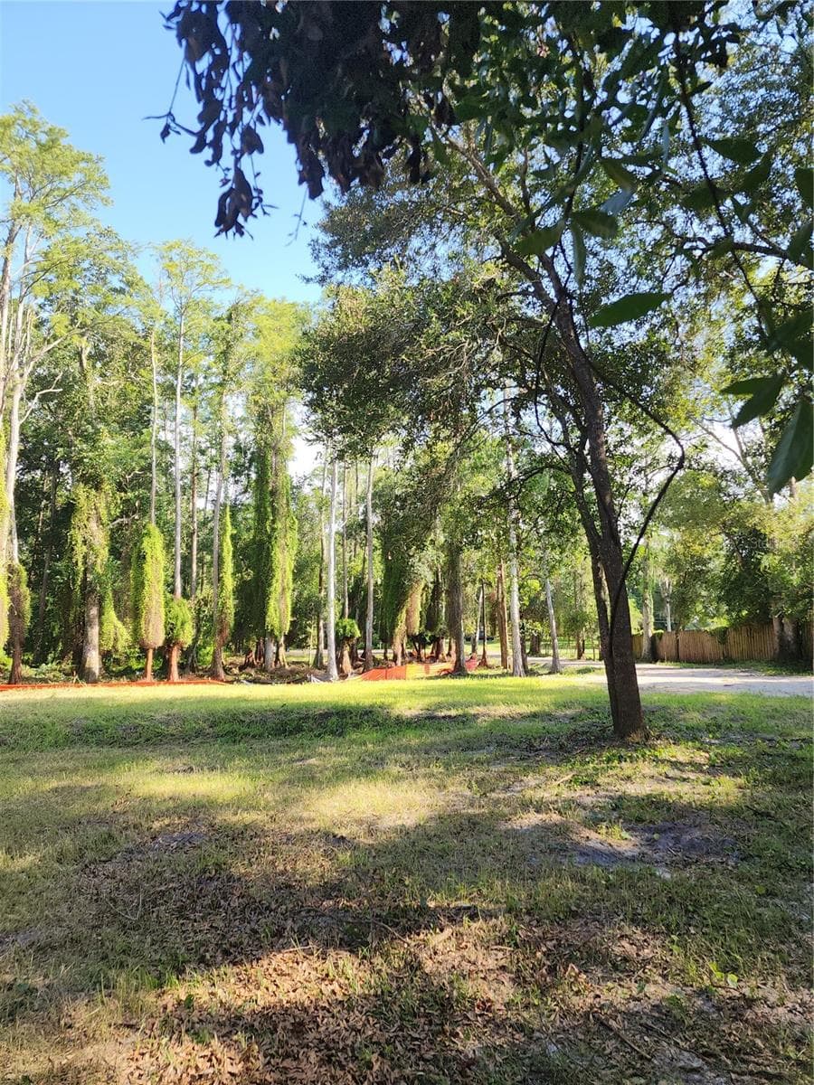 View from the rear property line looking 264 feet toward the street and cul-de-sac, showcasing the depth of the lot and prepared building site. Upland area is 0.4 Acre. - 7709 WINDWARD WAY, ODESSA