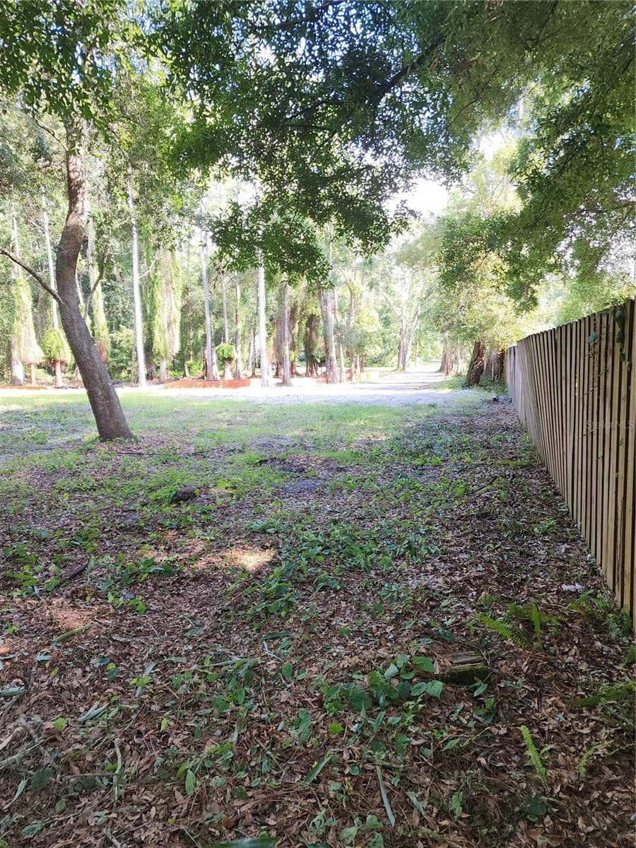 From the back left (NW) corner  of the lot looking south toward the driveway and cul-de-sac. The west lot line along the drive way is 264 feet long. - 7709 WINDWARD WAY, ODESSA
