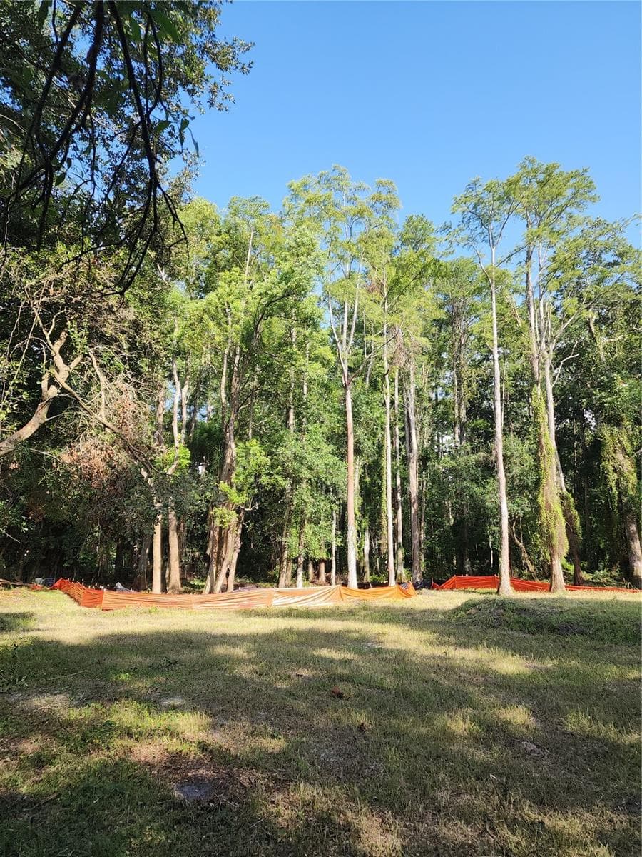 There is a large upland area that extends beyond the current Silt Fences into the woods all cleared and usable. - 7709 WINDWARD WAY, ODESSA