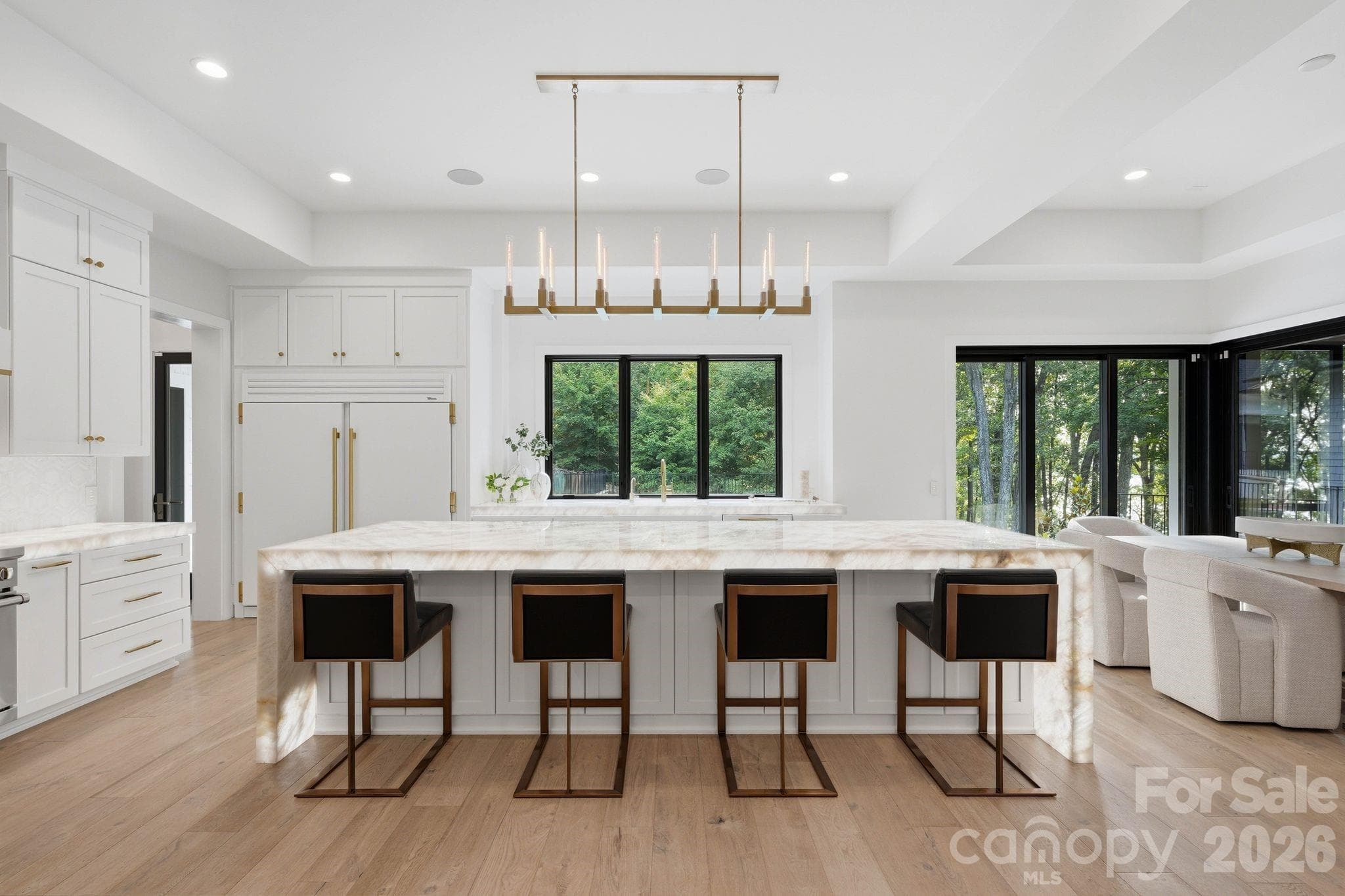 Illuminating Crystalita countertops, designer lighting is perfect for entertaining. - 13702 Sage Thrasher Lane, Charlotte