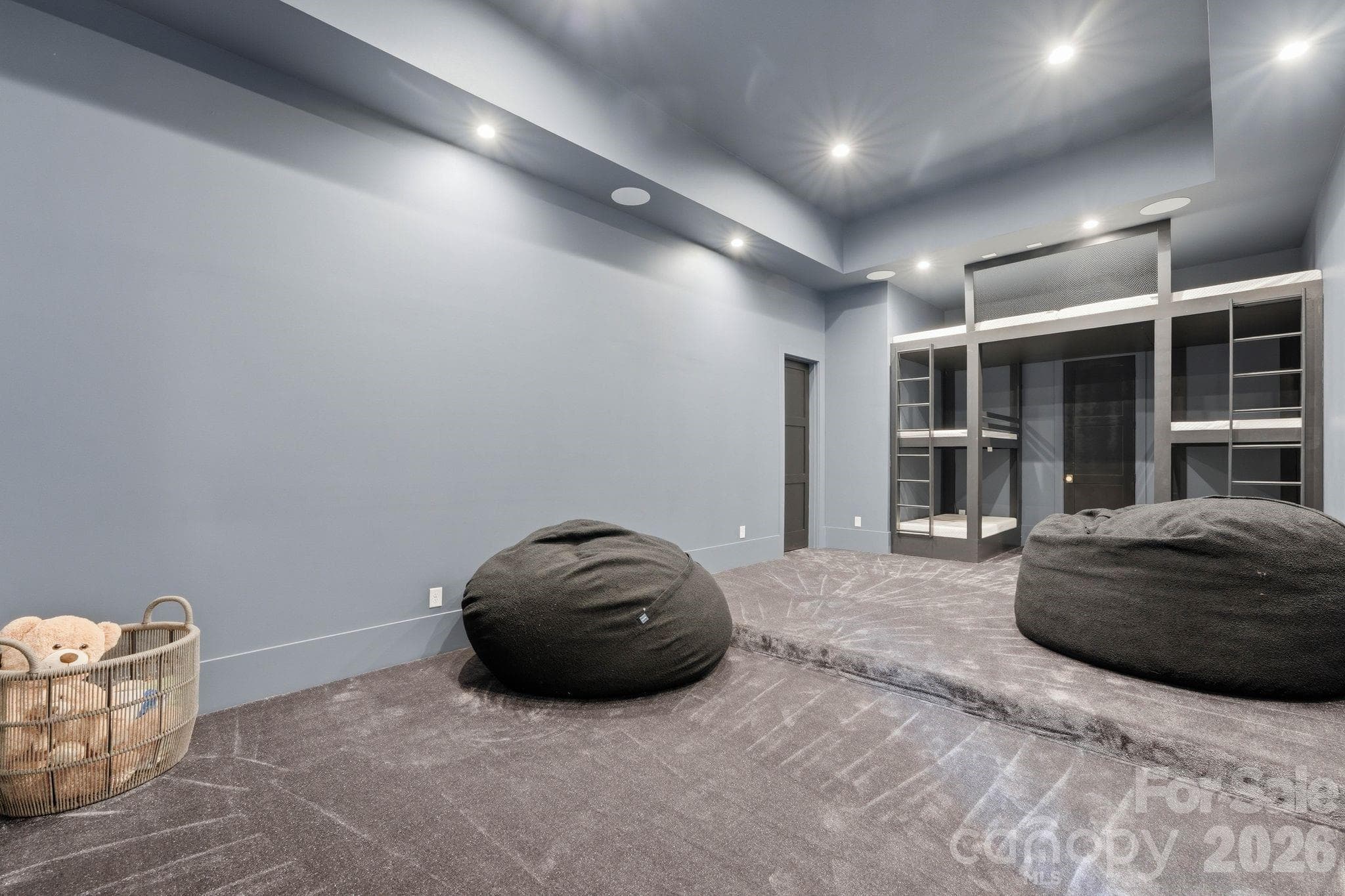 Theatre room that is prewired for a projector. How cool are the built-in bunk beds? - 13702 Sage Thrasher Lane, Charlotte