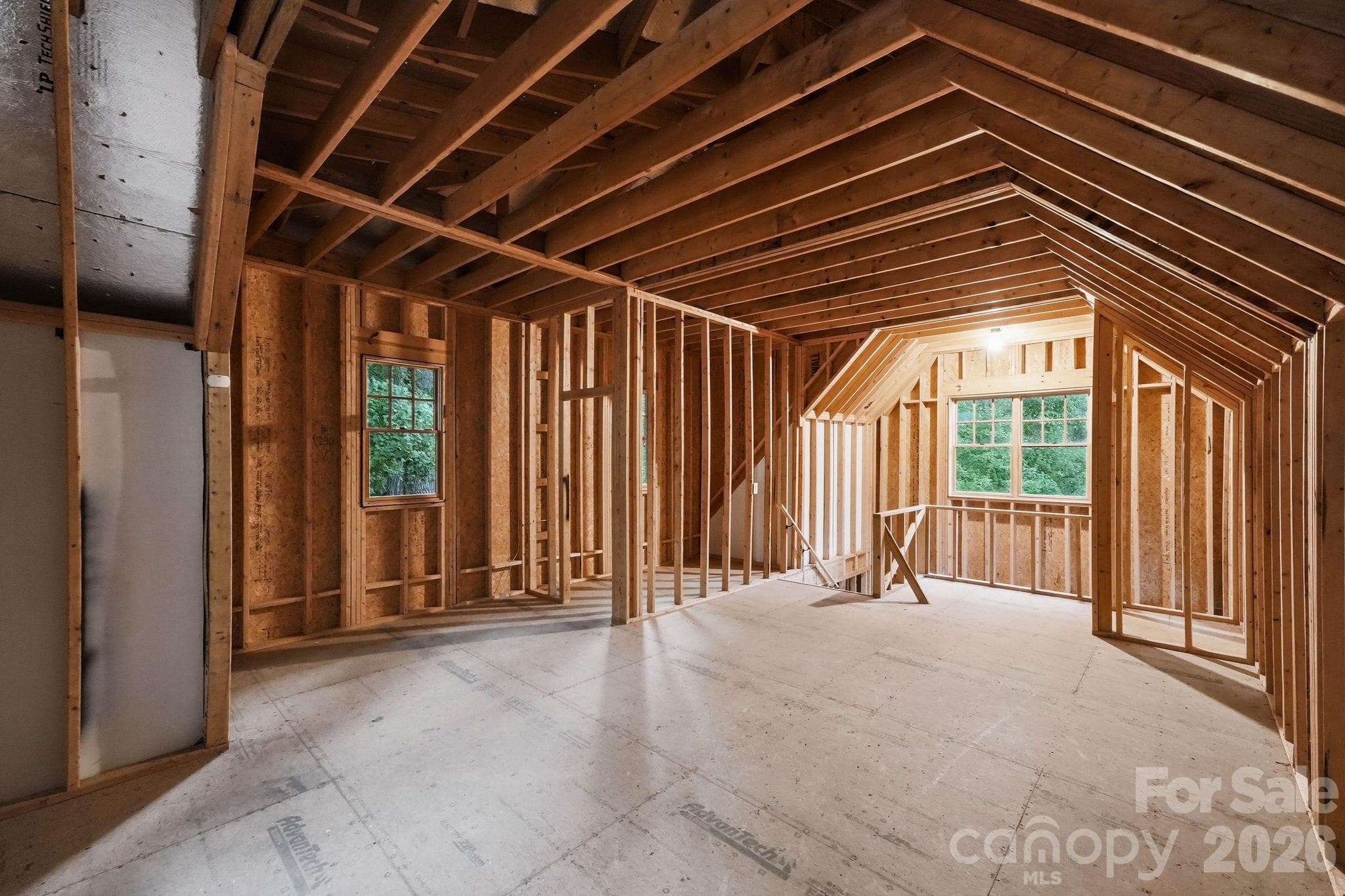 Unfinished space above the detached garage that is prewired and preplummed. - 13702 Sage Thrasher Lane, Charlotte