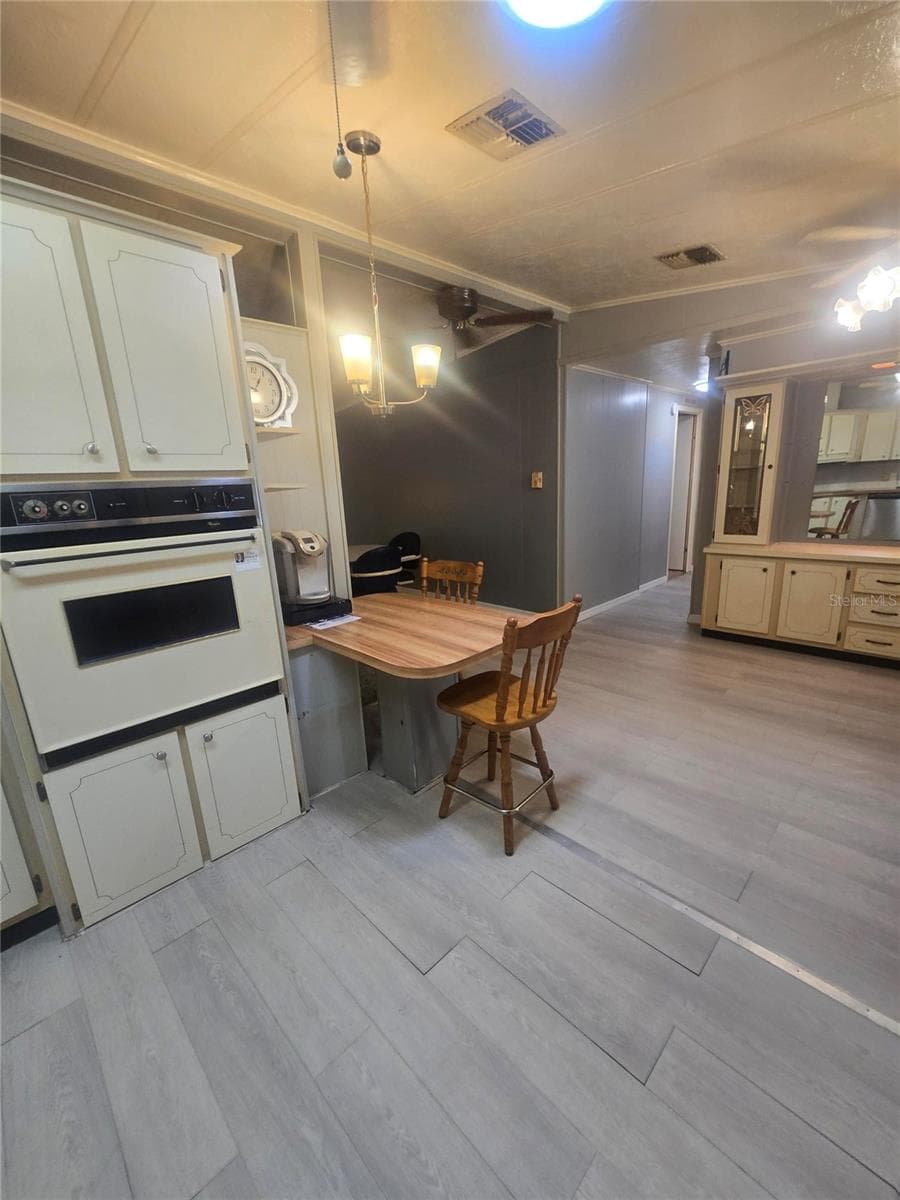 Kitchen showing built-in cabinets at end - 4645 BURNEY DR, HOLIDAY