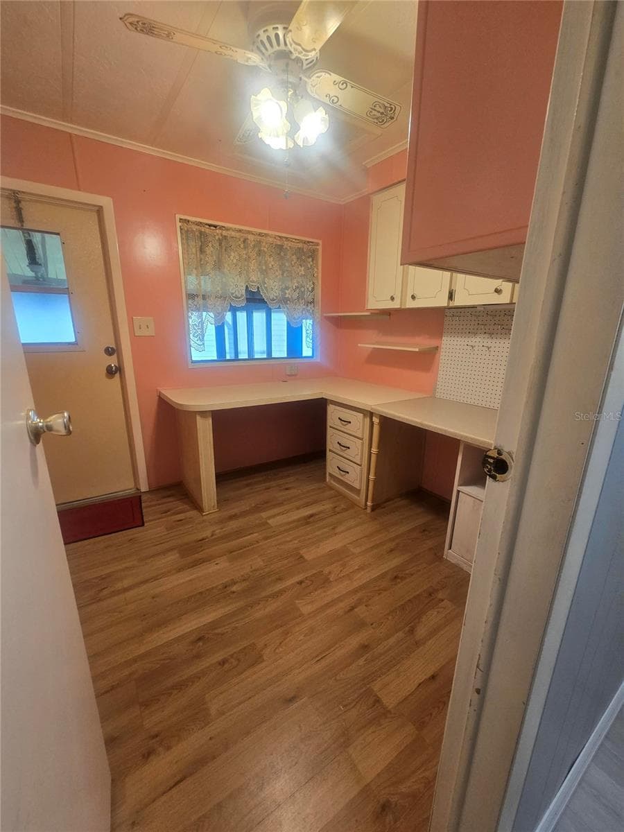 Office with desk and cabinets built in - 4645 BURNEY DR, HOLIDAY