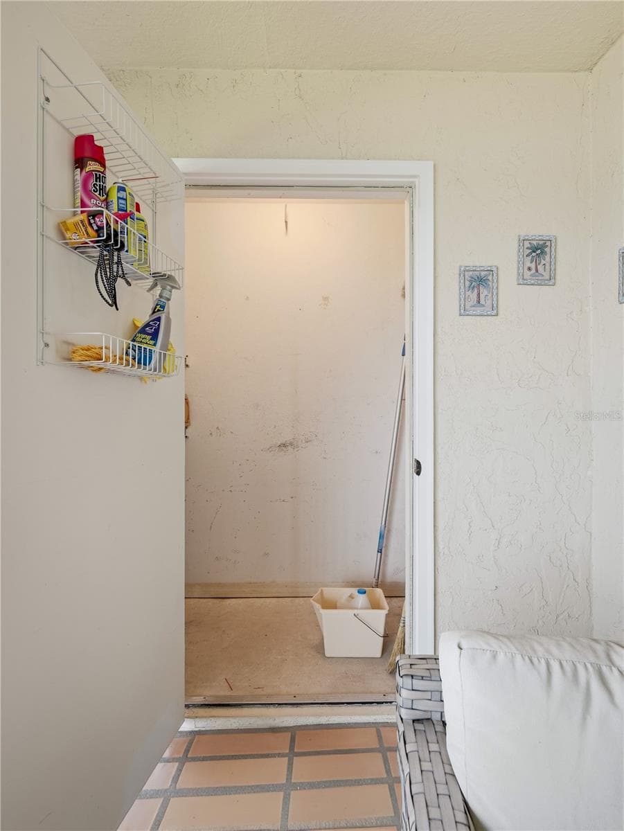 storage closet on balcony - 452 BOUCHELLE DR #204, NEW SMYRNA BEACH