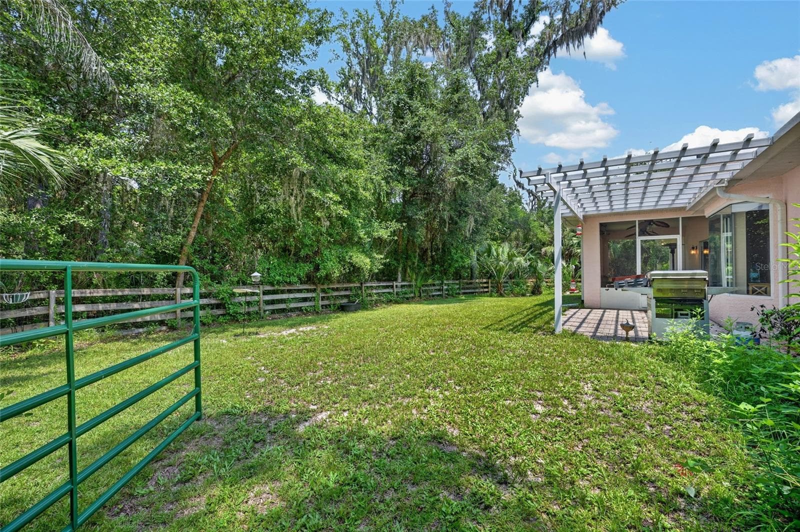 Gate to Partially Fenced Backyard - 19040 NW 88TH AVENUE RD, REDDICK