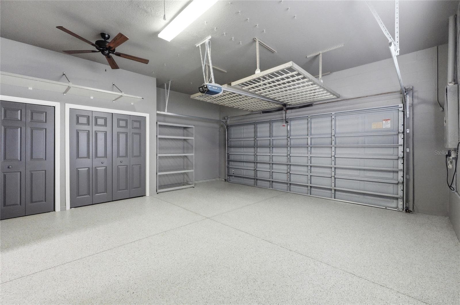 Spotless Garage with Storage Closets & Hanging Racks - 4040 PALMA CEIA CIR, WINTER HAVEN