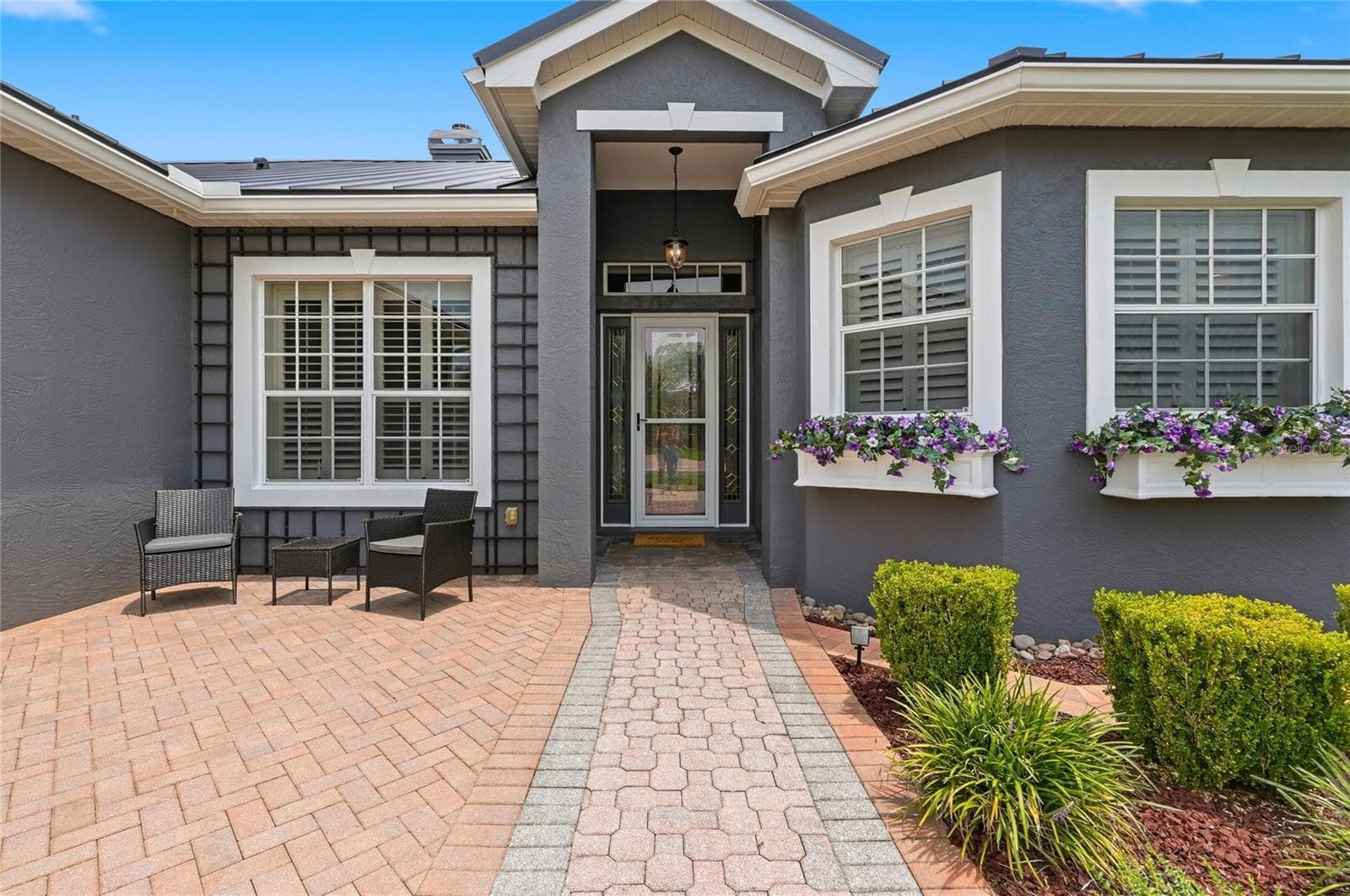 Welcoming Entry with Window Planter Boxes - 4040 PALMA CEIA CIR, WINTER HAVEN