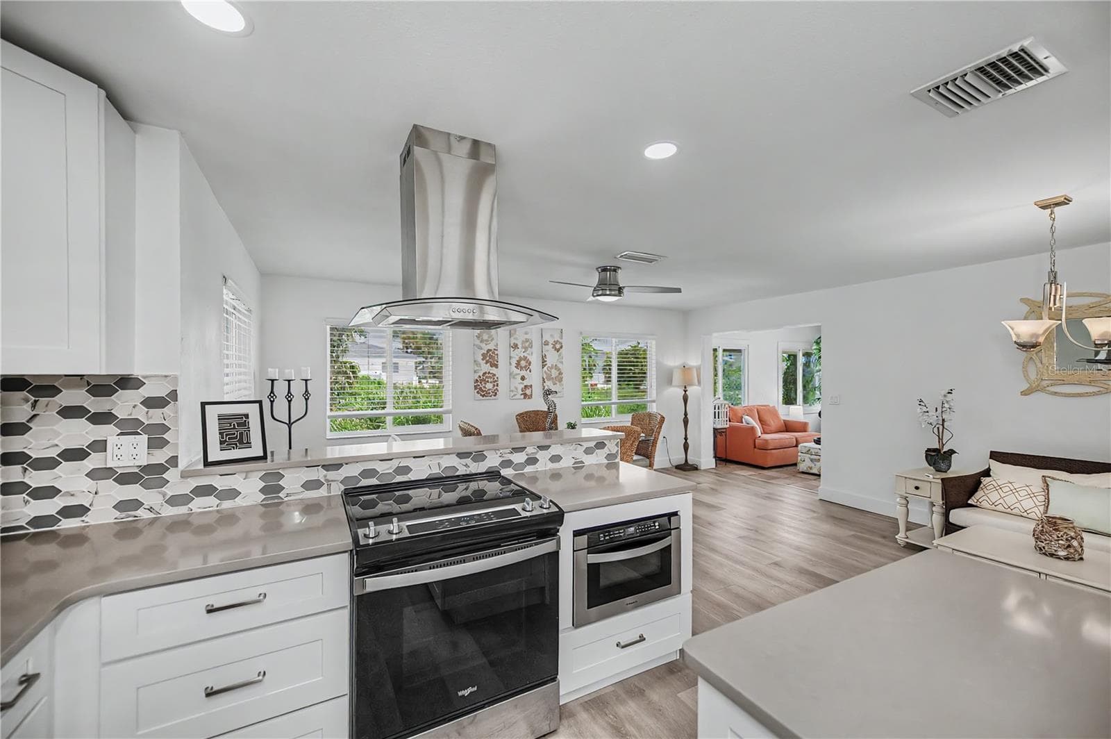 2nd Breakfast bar behind the stove and microwave - 8152 SEASHELL ST, ENGLEWOOD